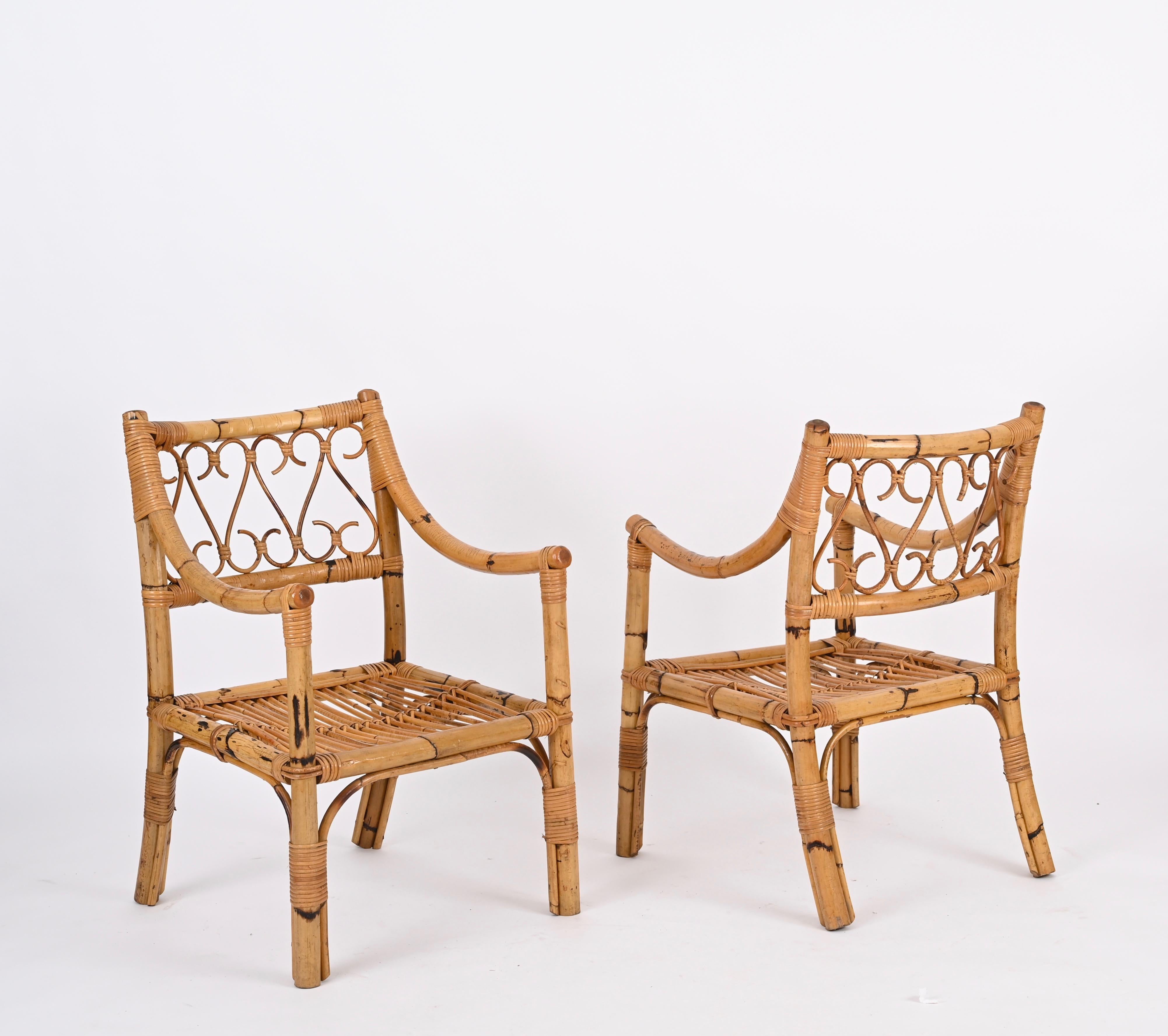 Pair of fantastic Mid-Century armchairs fully made in bamboo, rattan and wicker. This incredible set was produced in Italy by Vivai del Sud during the 1970s.

These comfortable armchairs have a structure made in sturdy curved bamboo, the backrest is