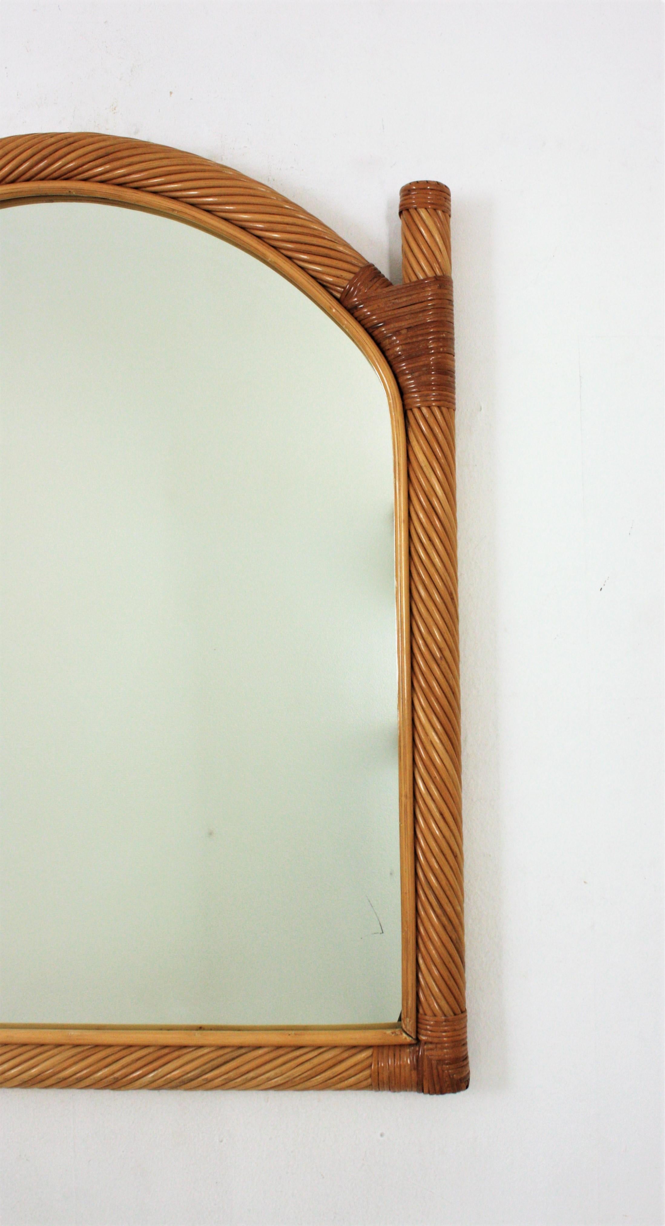 Hand-Crafted Two Vivai del Sud Rattan Pencil Reed Mirrors with Arch Top For Sale
