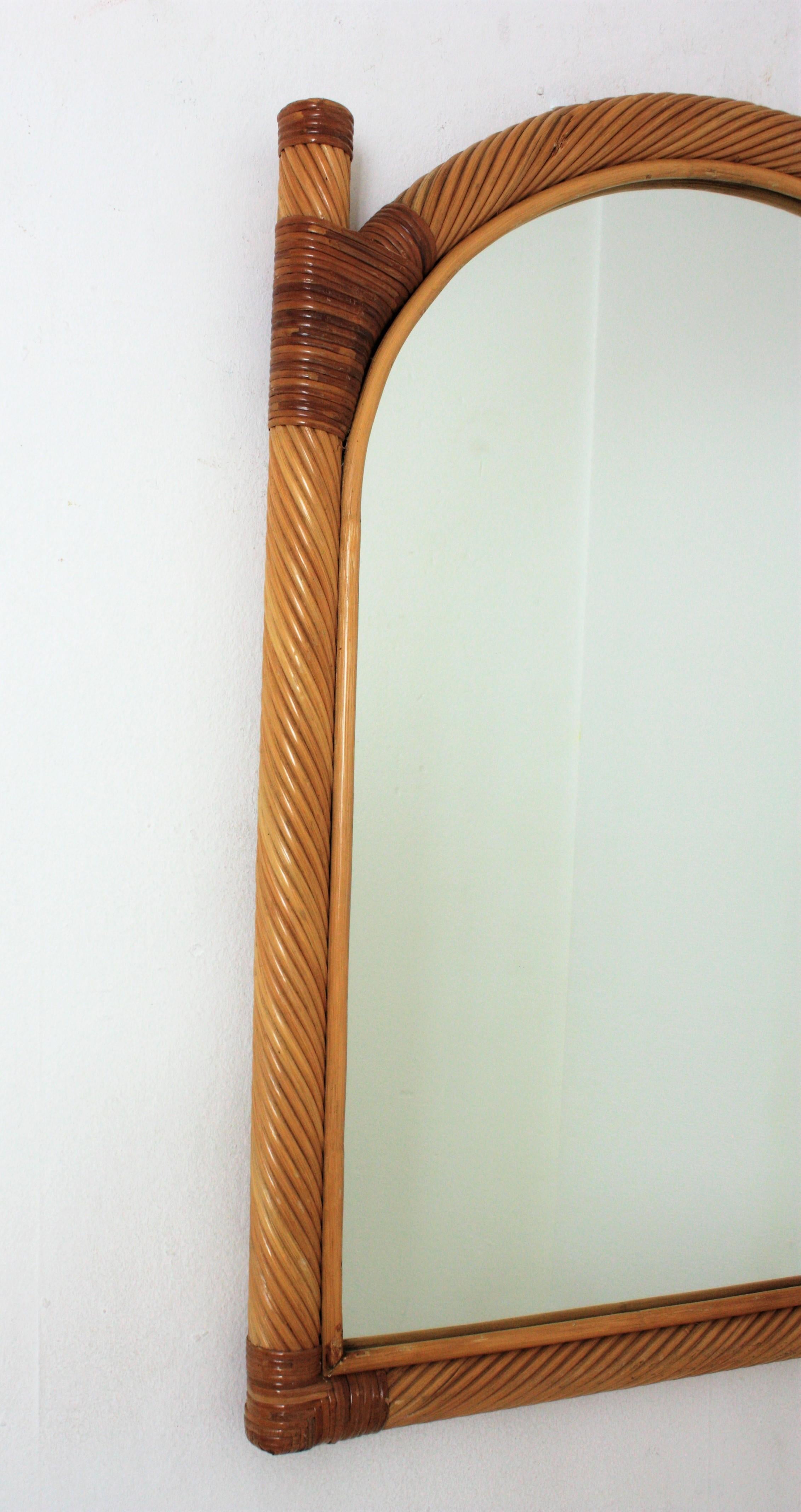 Cane Pair of Vivai del Sud Rattan Pencil Reed Mirrors with Arch Top For Sale