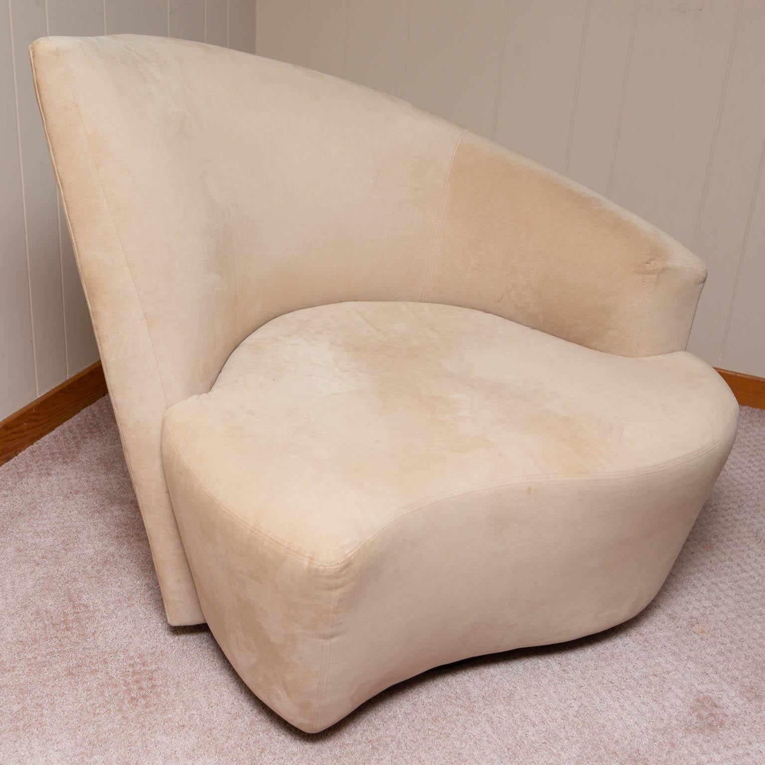 Made by Weiman in the mid-late 1990s, the matching pair of left and right Bilbao swivel chairs are covered in a sandy beige velour.