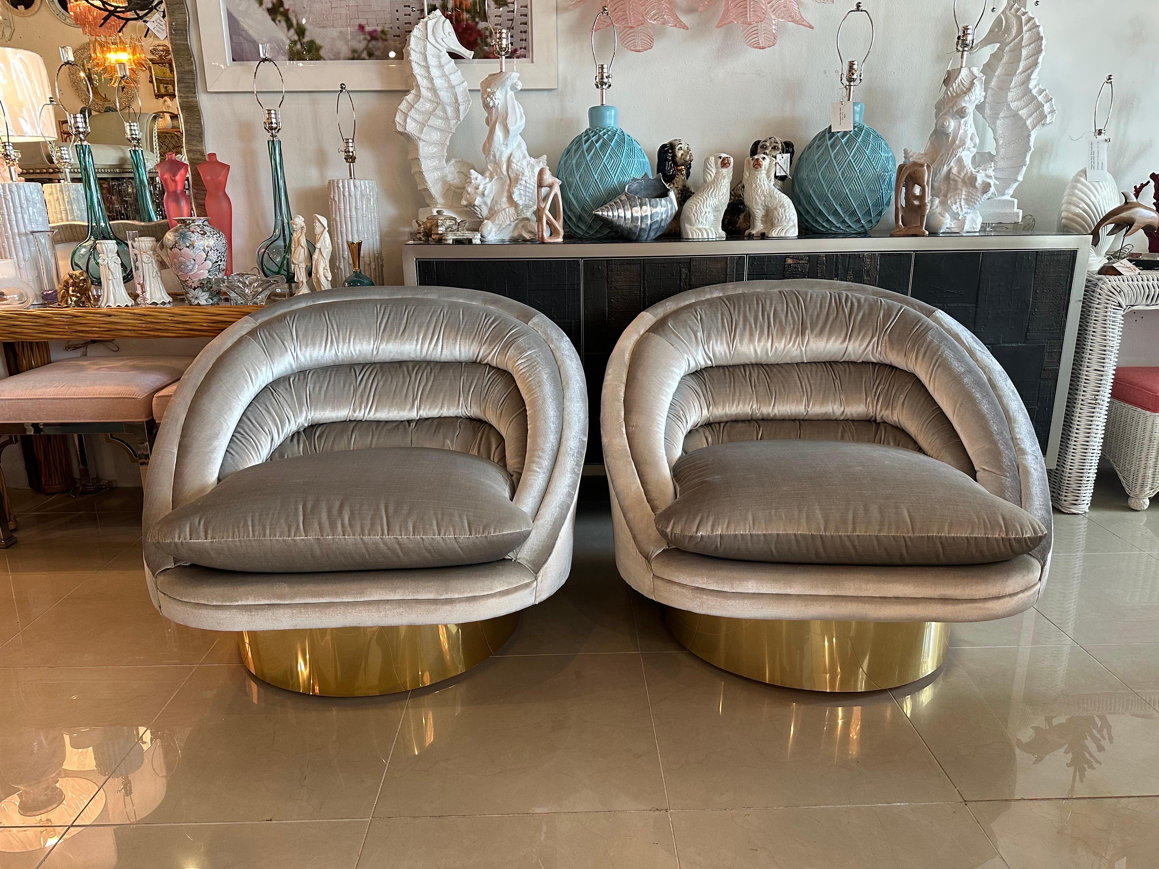 Pair of vintage Crescent chairs on brass bases with newly upholstered platinum Fabricut velvet. We had these done with a removable bottom cushion and zipper so it can be removed for dry cleaning if needed. It can also be flipped. The underneath