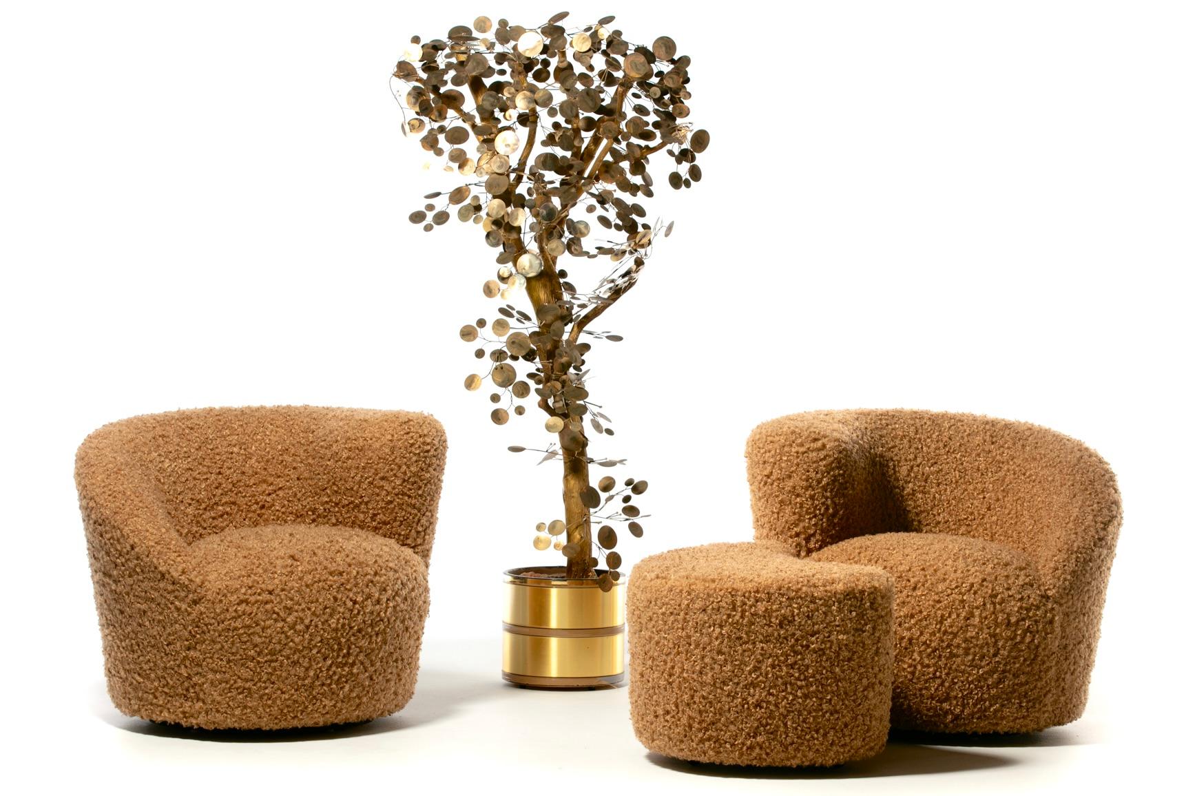 Amongst the most popular Vladimir Kagan designs, these Nautilus swivel lounge chairs are sculptural, comfortable and fun, and were recently professionally reupholstered in super soft curly camel. Modern with a warm and inviting texture. Corkscrew