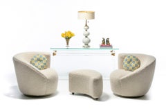 Pair of Vladimir Kagan Nautilus Swivel Lounge Chairs and Ottoman in Ivory Bouclé