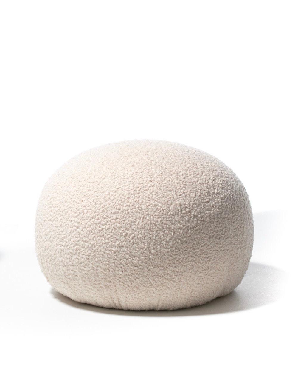 Timelessly sexy pair of poufs ottomans by Directional professionally reupholstered in soft ivory white bouclé with high durability rating. Plush and comfortable, the poufs can be easily incorporated as ottomans with other designer pieces. Want to