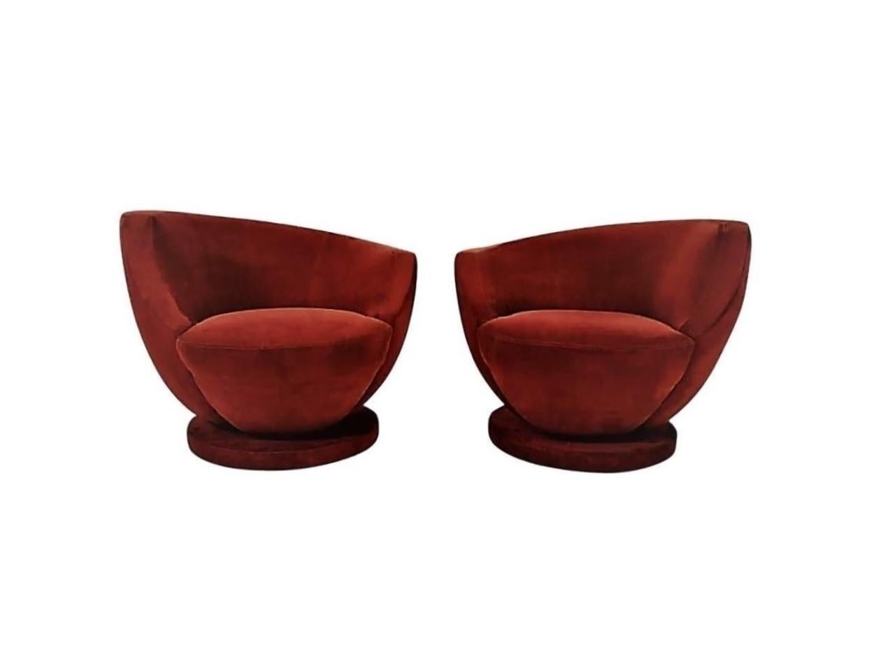 Offered is a beautiful pair of rare Nautilus style swivel chairs born from the ingenuity of the celebrated Mid-Century Modern Icon Vladimir Kagan. Modern, warm and inviting this is a revolutionary model in comfort and style. Three quarter moon back
