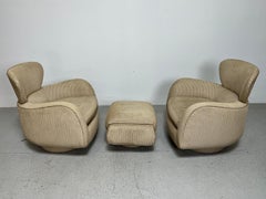 Pair of Vladimir Kagan Rocking Swivel Chairs and Ottoman