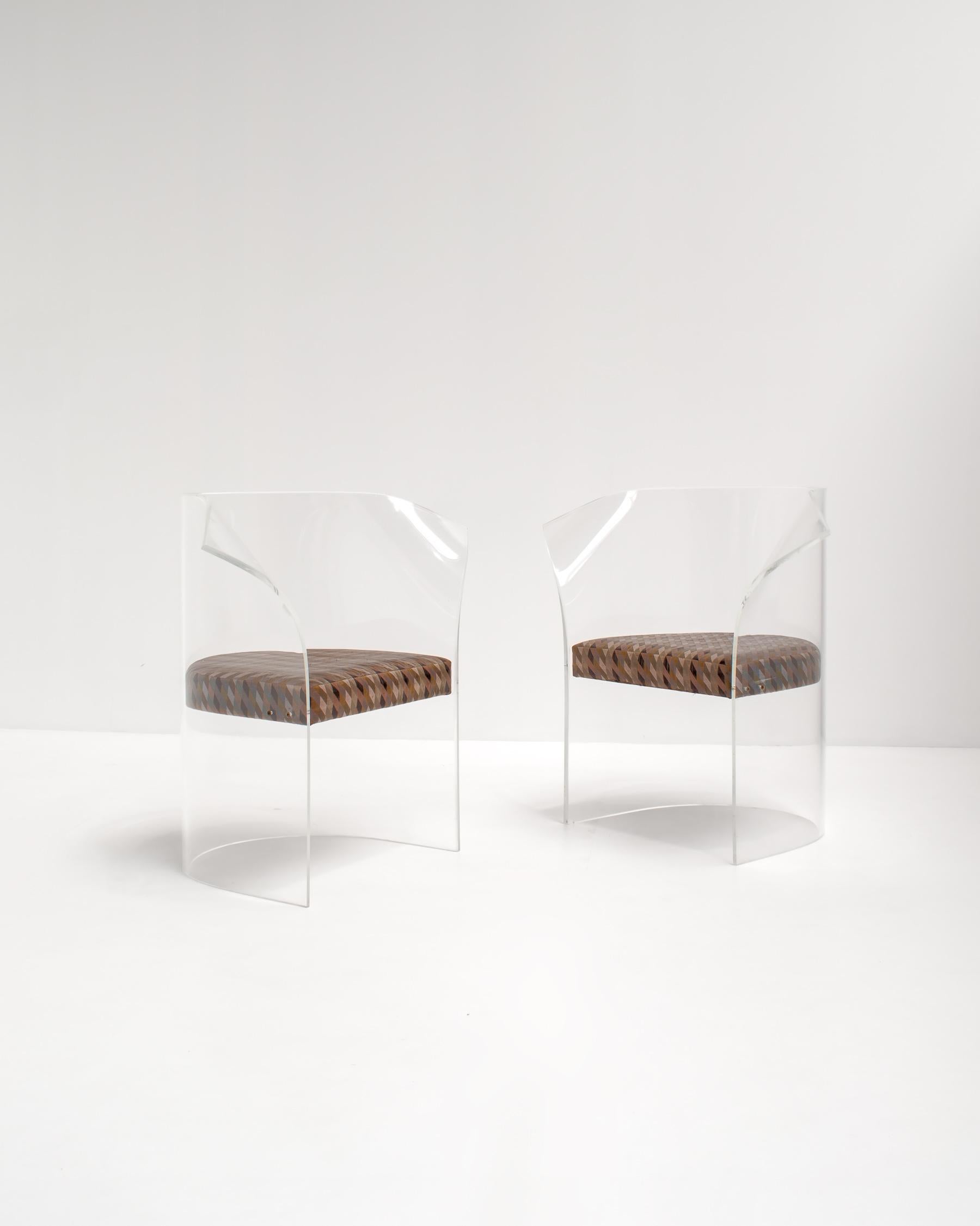 Pair of acrylic armchairs made of heavy & thick high quality lucite. 

Since they are transparent and because the cushions are suspended, it seems to appear the cushions are floating. These chairs are very decorative and give every project an