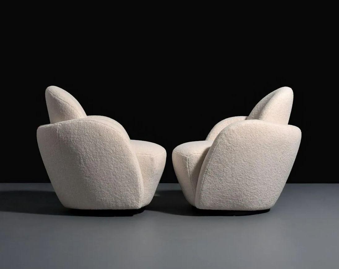 A sculptural pair of swivel lounge chairs by by the legendary furniture designer for Directional, circa 1980s. Glamorous at every turn! Kagan's post-modern style-that is over-the-top, inspired by the curves and undulations of the Guggenheim Museum