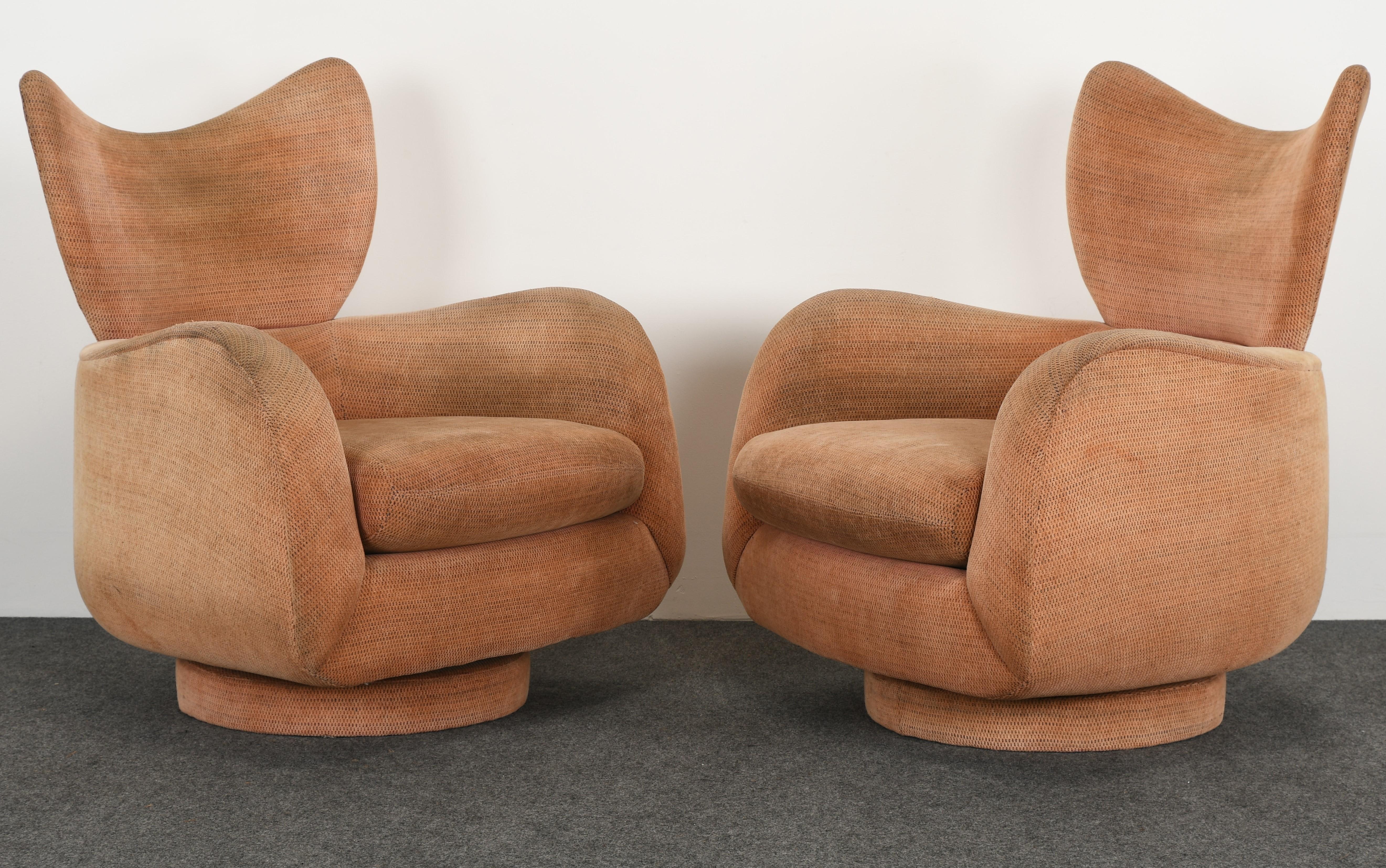 A fabulous pair of Vladimir Kagan wingback swivel and rock chairs originally from the 1980s era. Great shape and form to reupholster in your choice of fabric. Condition: Mechanism works well for swivel and rock features.

Dimensions: 39.5