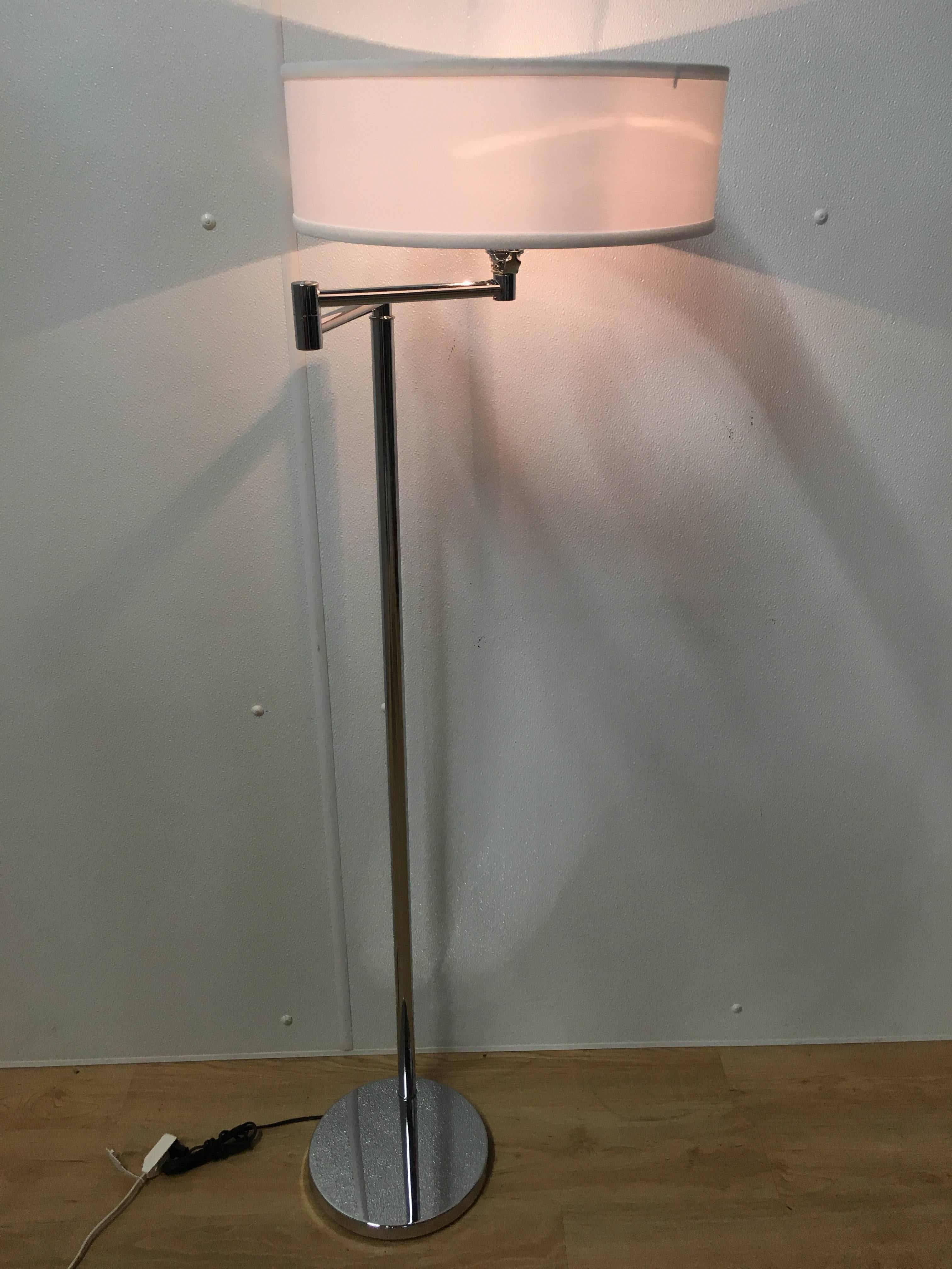 A pair of Walter Von Nessen articulated chrome floor lamps. With adjusted width swing arm (adjusts from 8.5