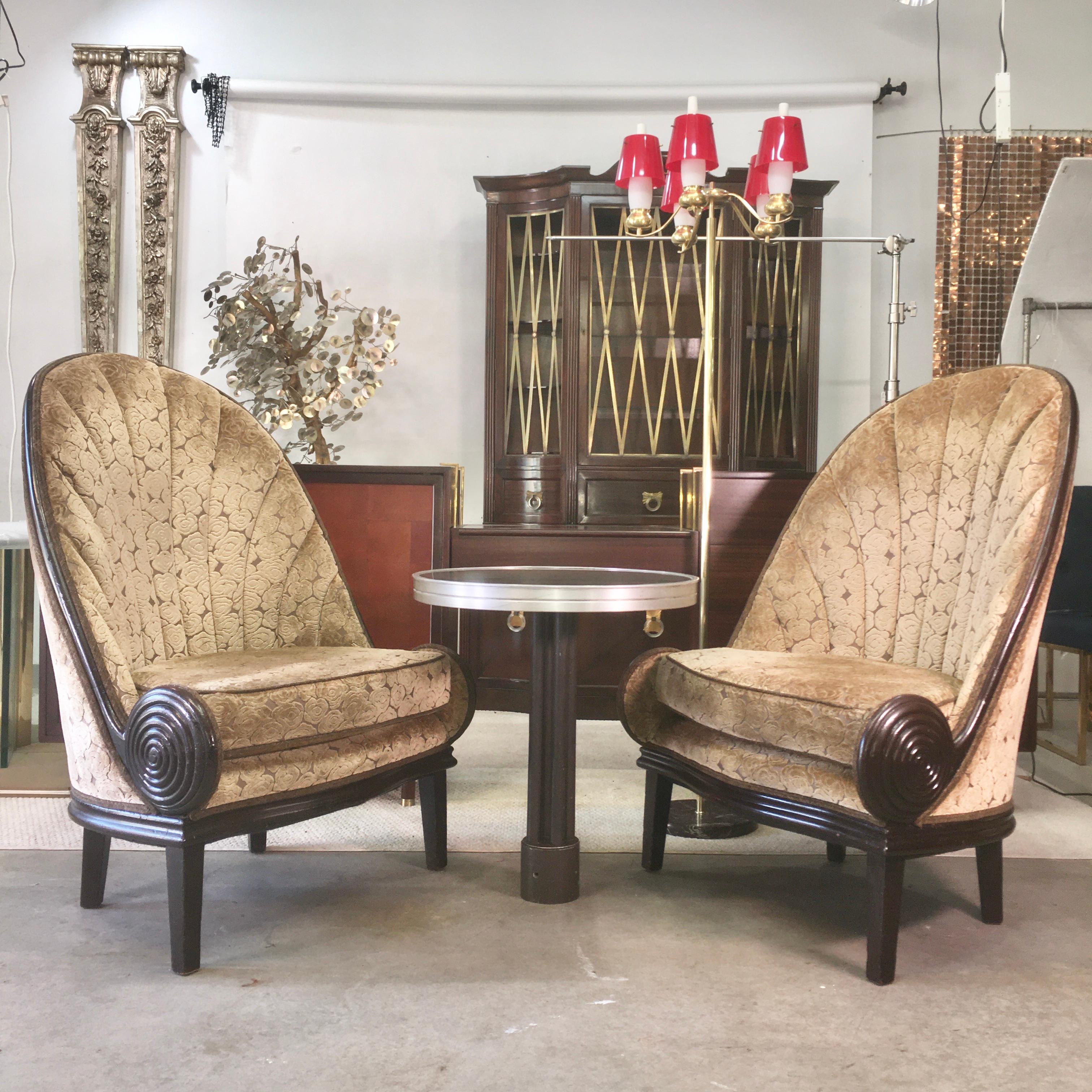 We are fortunate to have acquired two pair of these amazing gondola chairs from the glamorous and historic Waldorf Astoria Hotel.
There were only a total of 12 of these generously scaled chairs upholstered in an art deco cut velvet and were situated