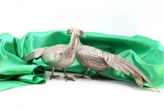 Pair of walking pheasants in silver with reliefs and applications