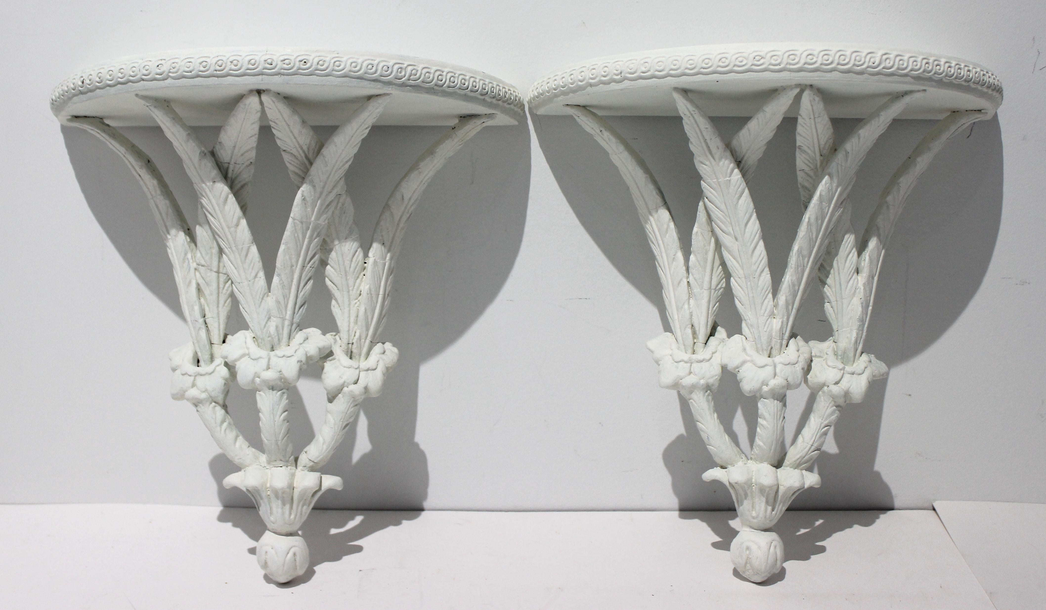 Vintage wall brackets stylized feathers painted white - a pair - from a Palm Beach estate.