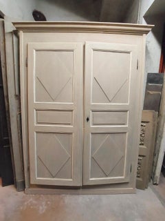 Pair of wall cabinets, lacquered placard with carved lozenges, 19th century Ital