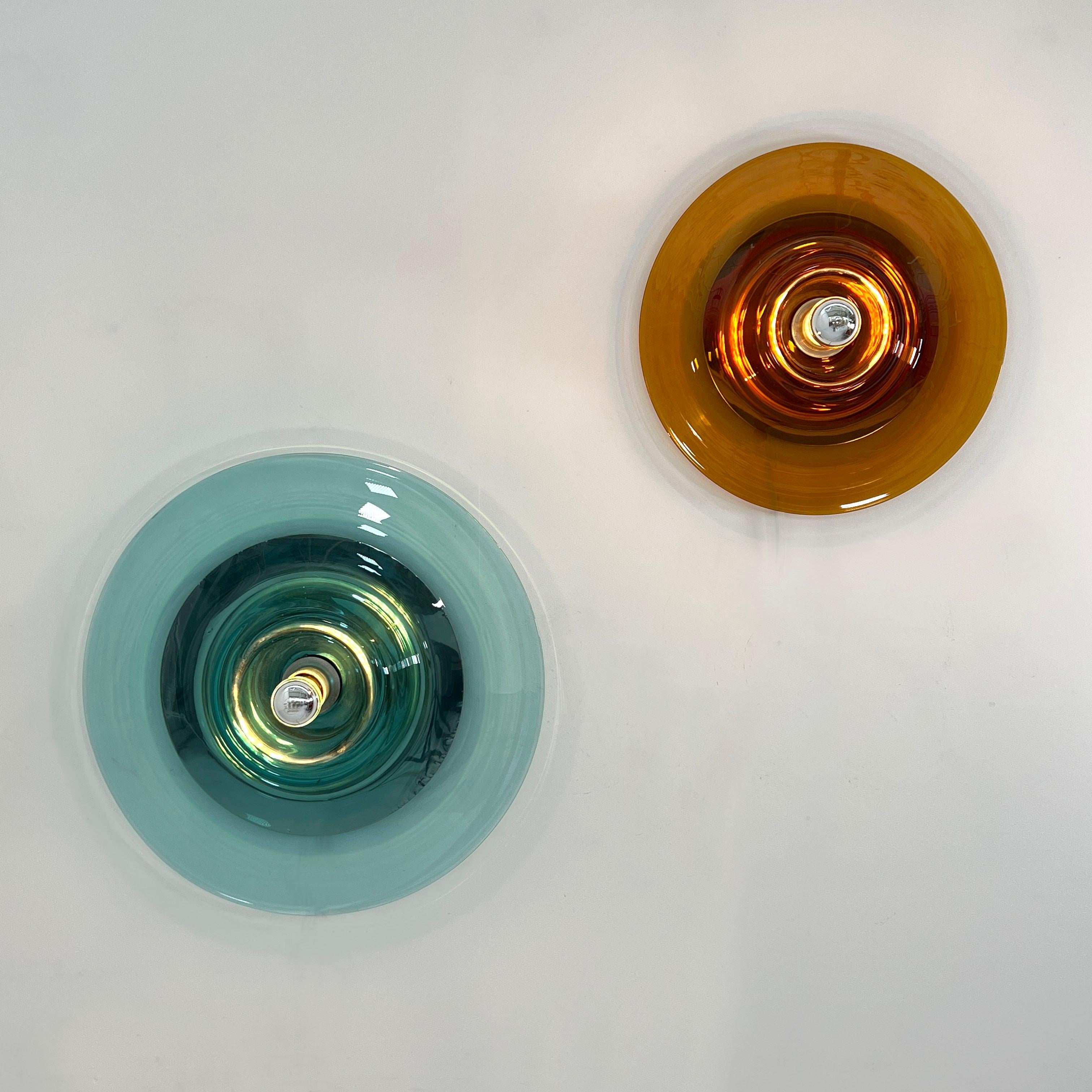 Pair of Wall Lamps in Murano Glass by Pierre Cardin for Venini, 1969

Designer - Pierre Cardin
Producer - Venini
Design Period - 1969
Measurements - Blue = Width 60 cm x Depth 13 cm x Height 60 cm. Amber = Width 45 cm x Depth 13 cm x Height 45