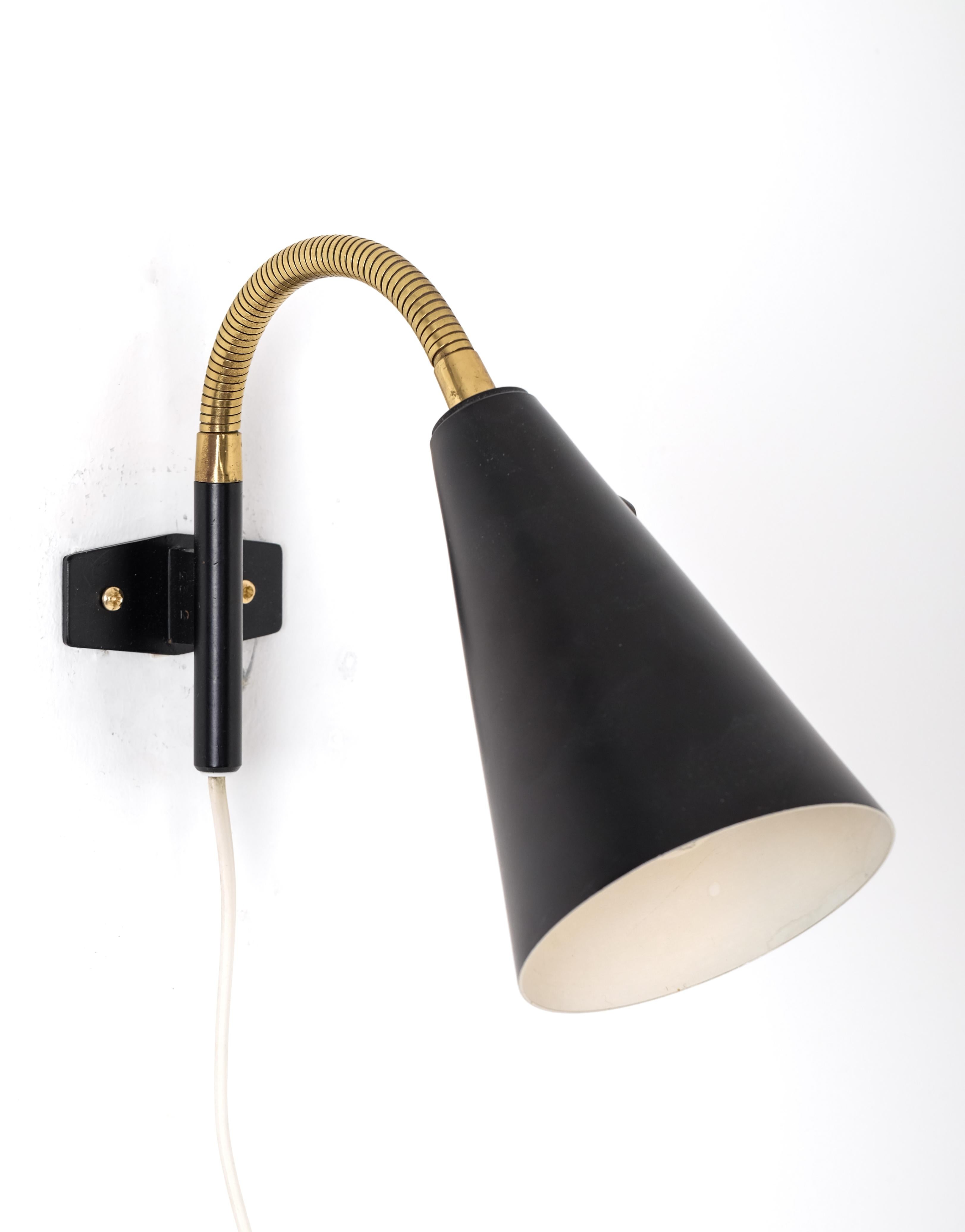 Set of 2 black lacquered metal wall lamps with brass details, produced in Sweden, 1950s. New wiring.