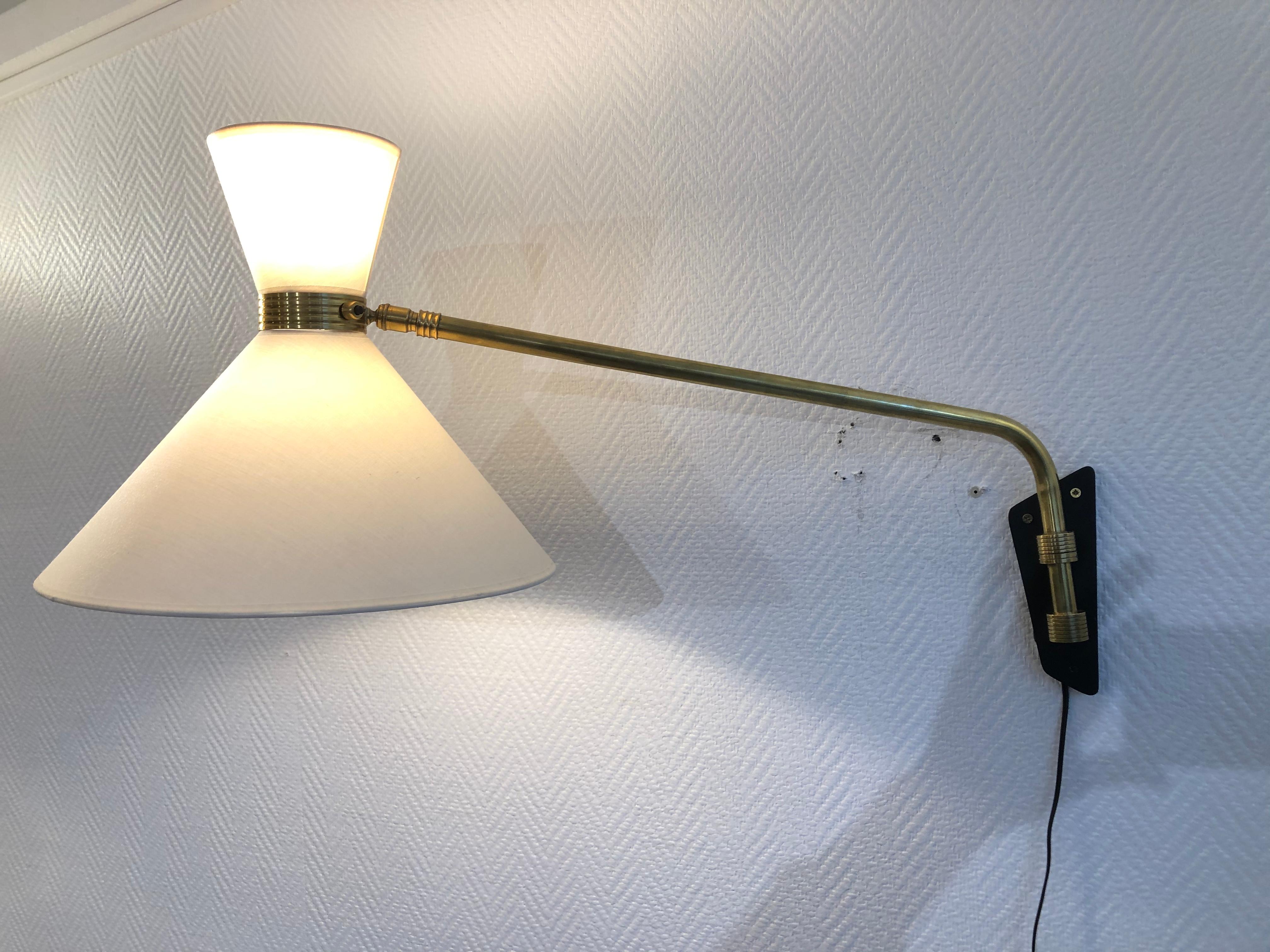 Pair of wall lights adjustable by Arlus
from 1950
in brass.
