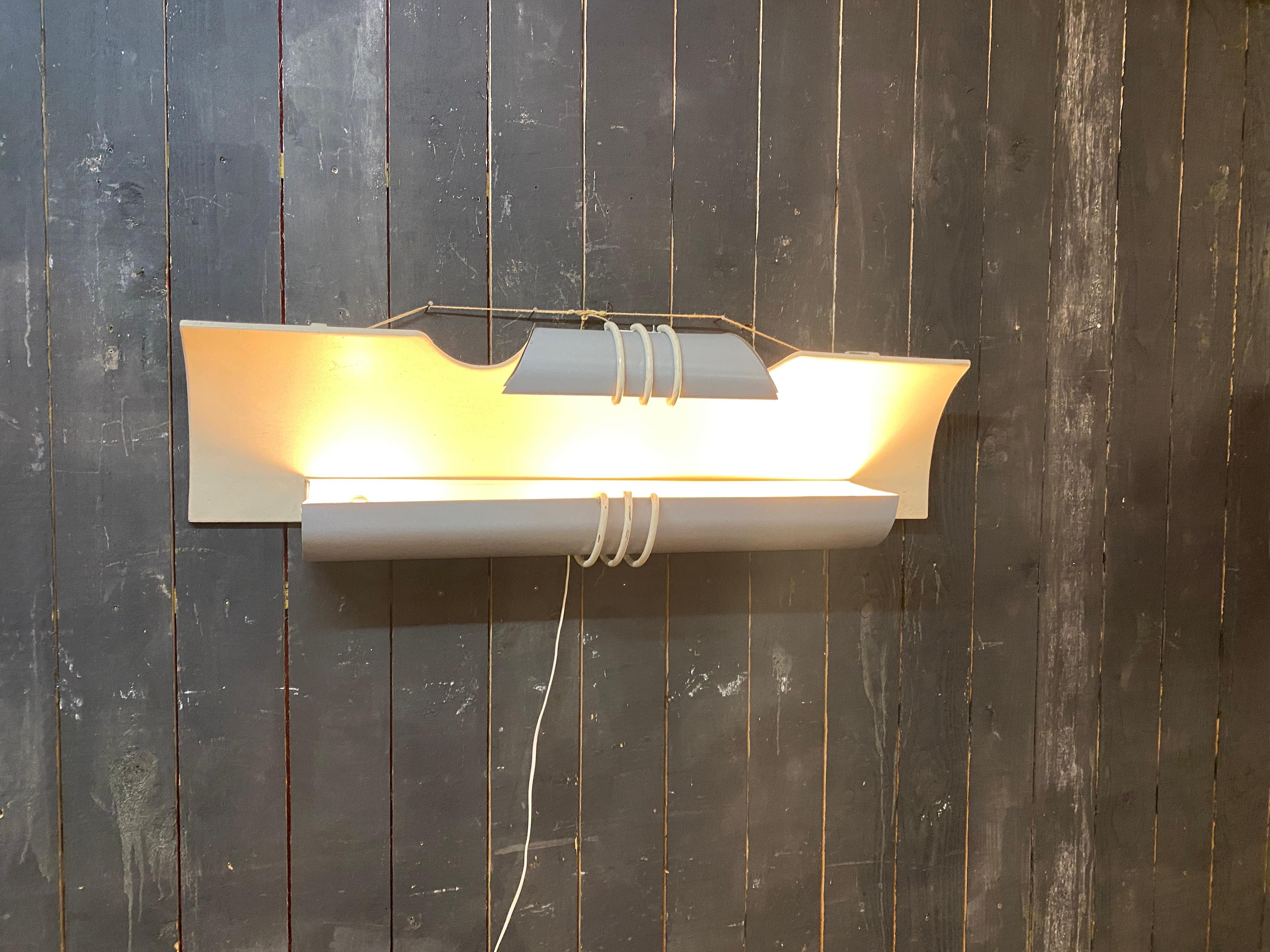 2 large wall lights circa 1970/1980, from a cinema
unlit the color of the metal is light gray and white