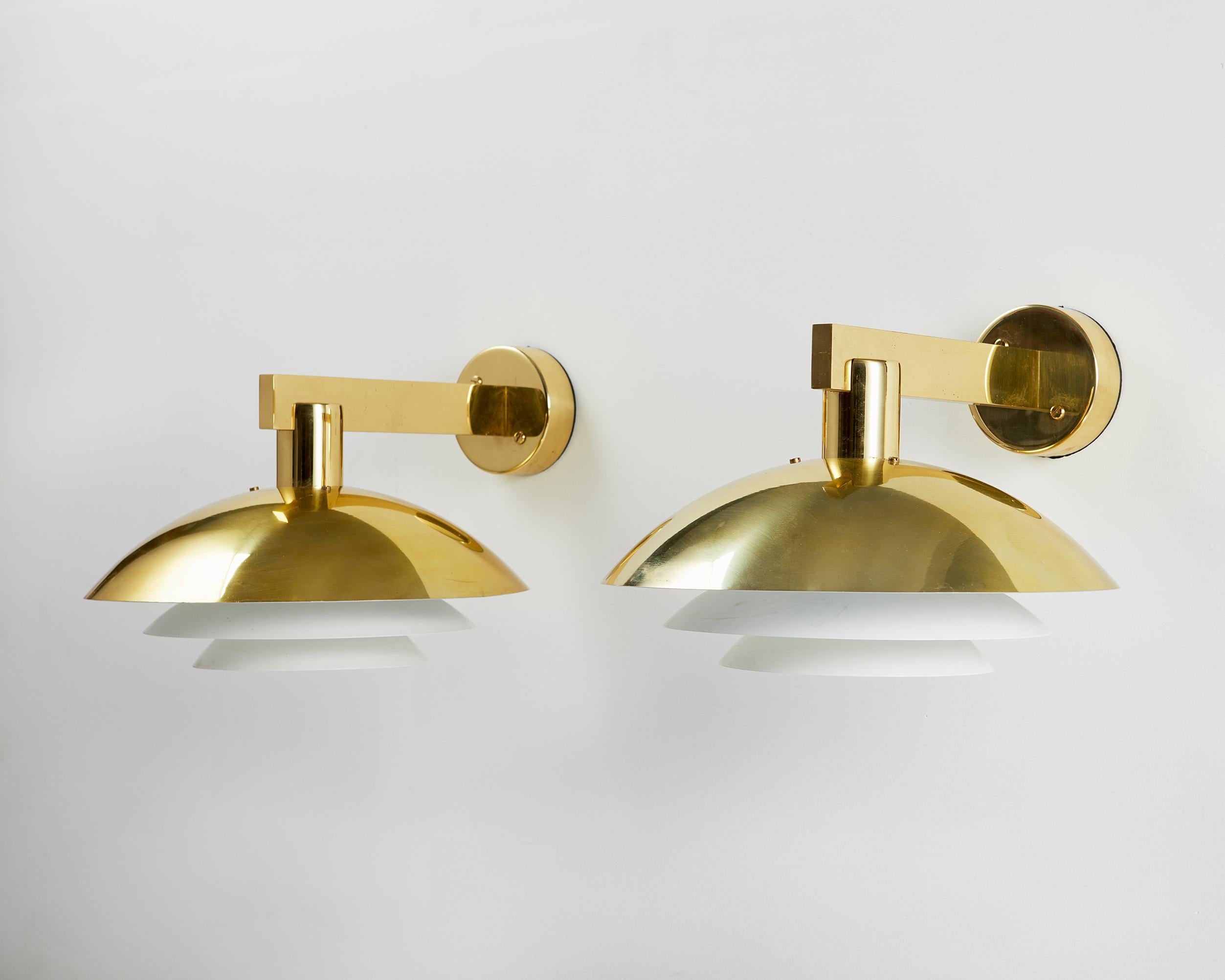 Brass and lacquered brass.

Provenance: Näsby Slott, Täby.

Active between the 1950s and 1970s—in the golden age of Scandinavian design—Swedish interior decorator and furniture designer Hans-Agne Jakobsson is best remembered for his softly glowing,