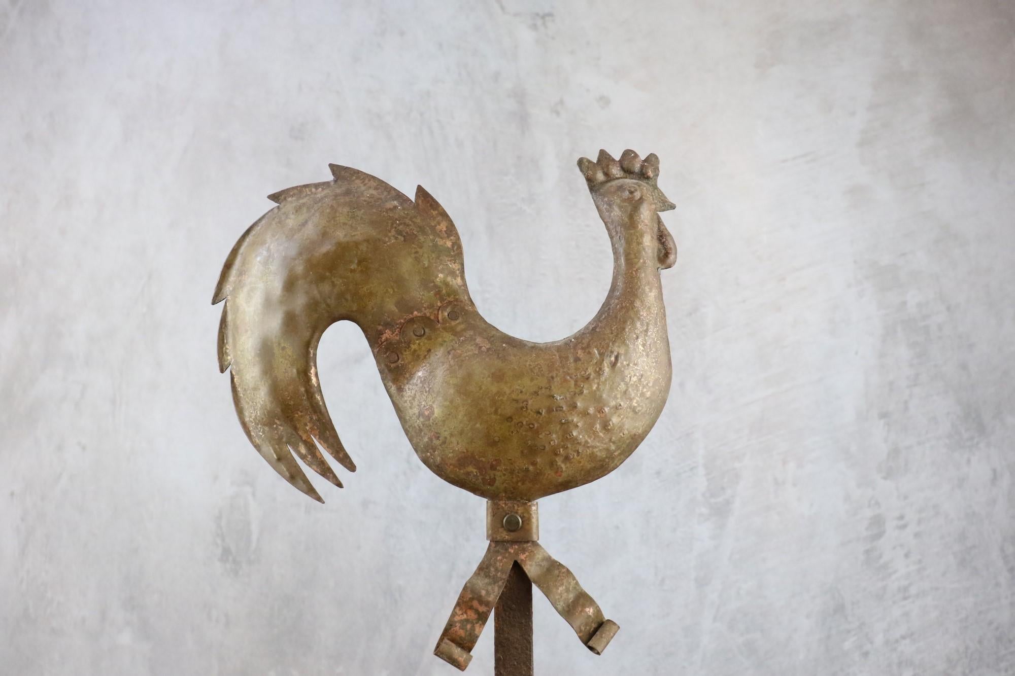 Wall lights in hammered iron with rooster decoration, 1940-1950, France

Superb hammered-iron sconces, nicely patinated, with rooster decoration in the style of the work of Jean Touret, Ateliers Marolles.  
The lights imitate candlesticks. 
Their