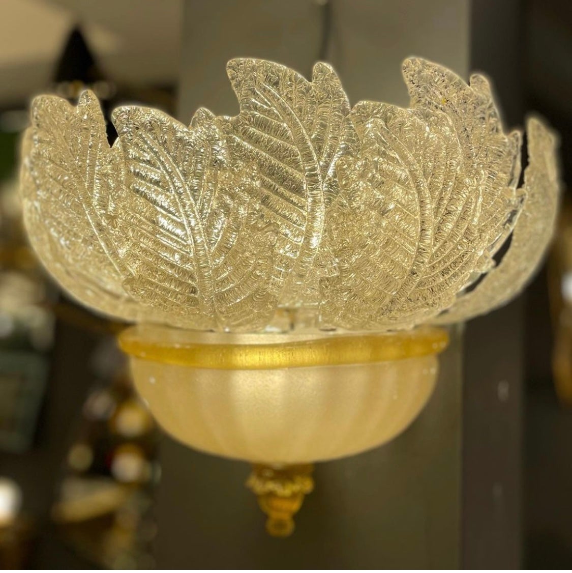 Stunning pair of Barovier and Toso Murano wall lights. Each wall light is made of 9 mouth-blown hand-formed leaf-form golden powder glass panels plus a huge glass as a bottom. This beauty has the look of a precious big flower. All glass parts are in