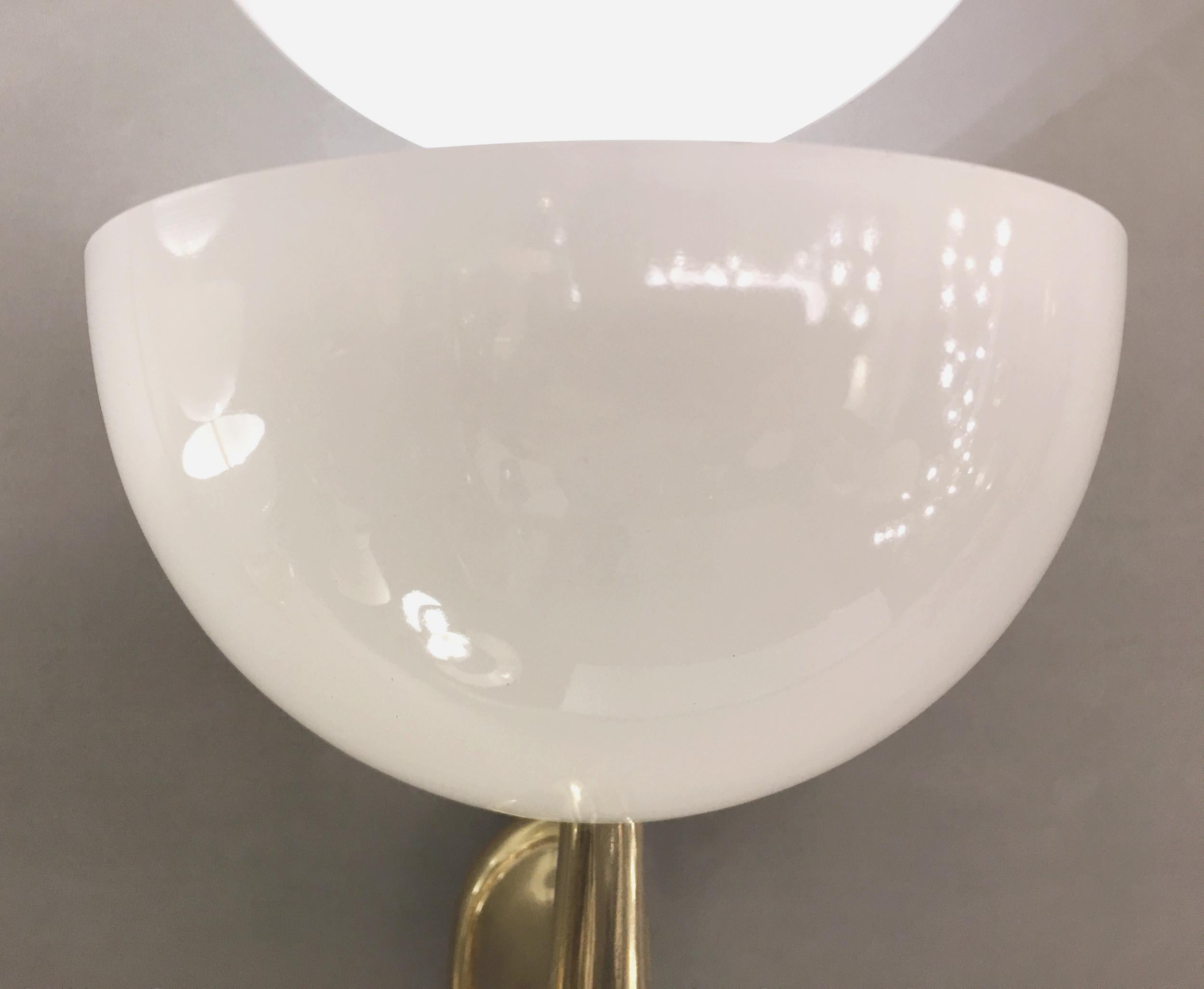 Mid-20th Century Pair of wall lights in solid brass, lacquered metal, Stilnovo, Italy, circa 1960