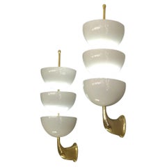 Pair of wall lights in solid brass, lacquered metal, Stilnovo, Italy, circa 1960