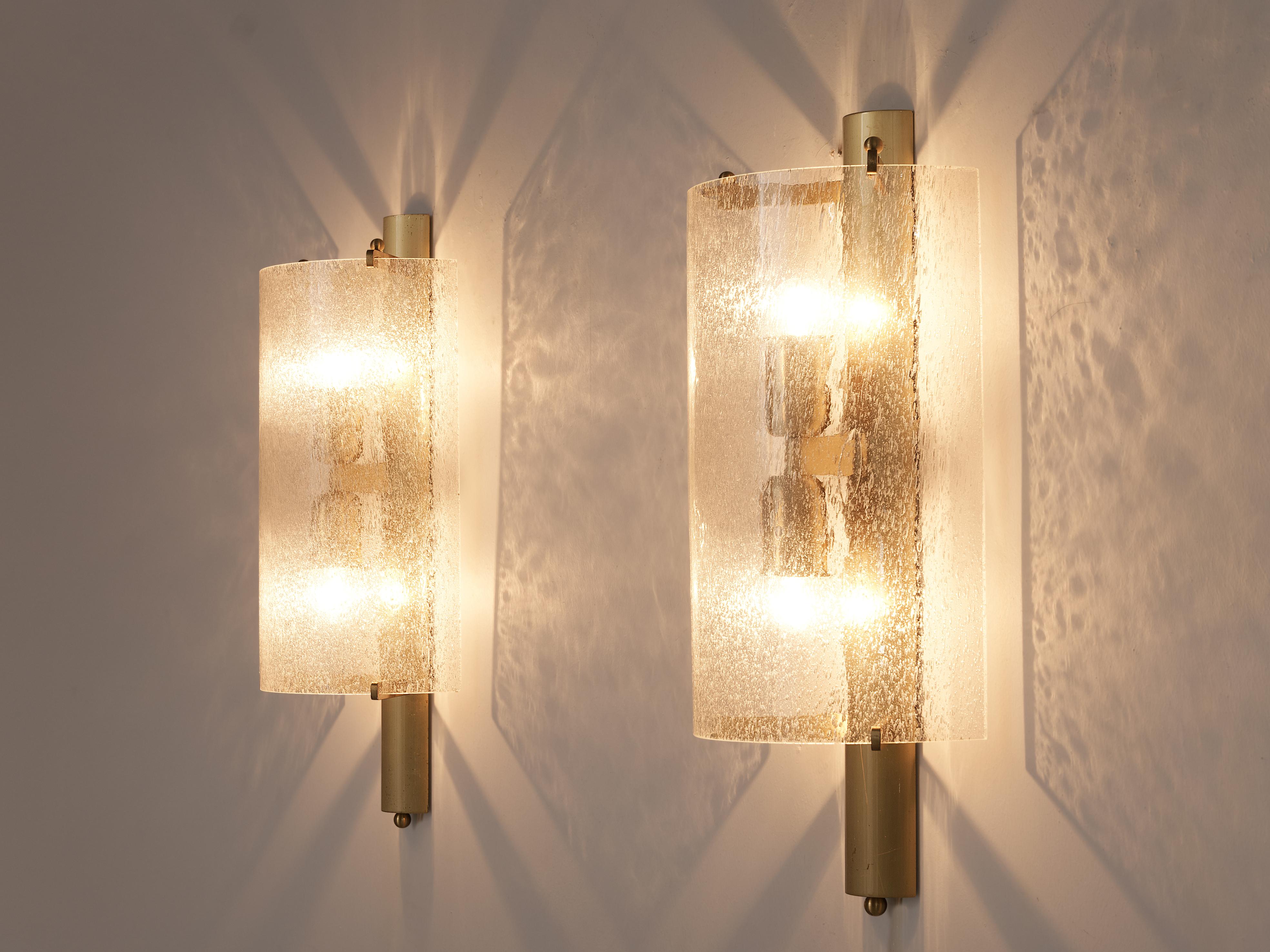 Wall lights, brass, glass, Europe, 1960s

This pair of solid wall lights has beautifully shaped half circles as shades. The frame is made out of very warm brass. The lights work nicely individually yet function very well as a pair too. The quality