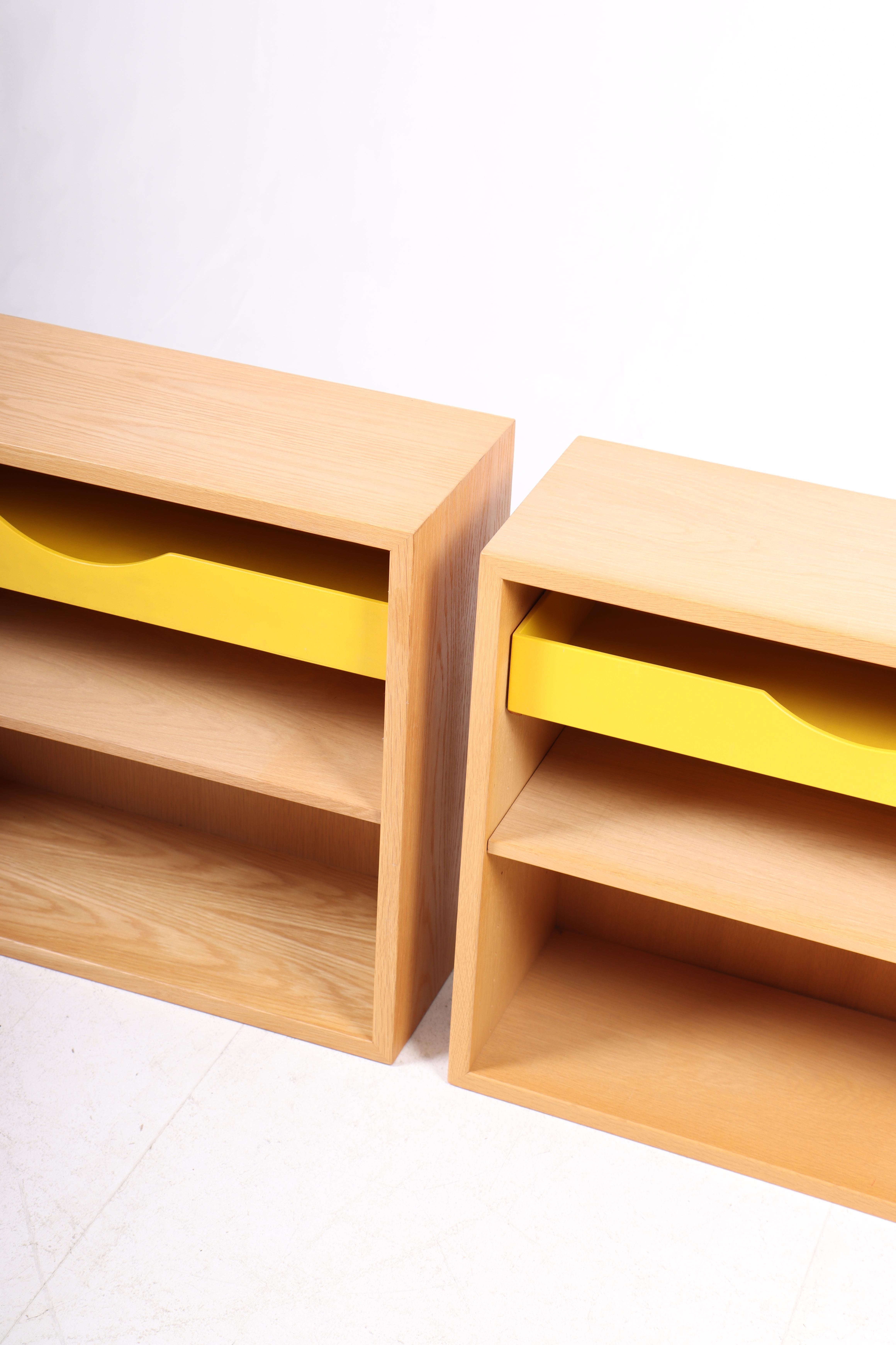 Pair of wall mounted nightstands in oak with adjustable shelves. Designed by Danish architect Børge Mogensen for Karl Andersson cabinetmakers. Made in Sweden in the 1960s. Great original condition.