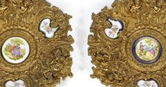 Pair of wall plates; in gilded bronze