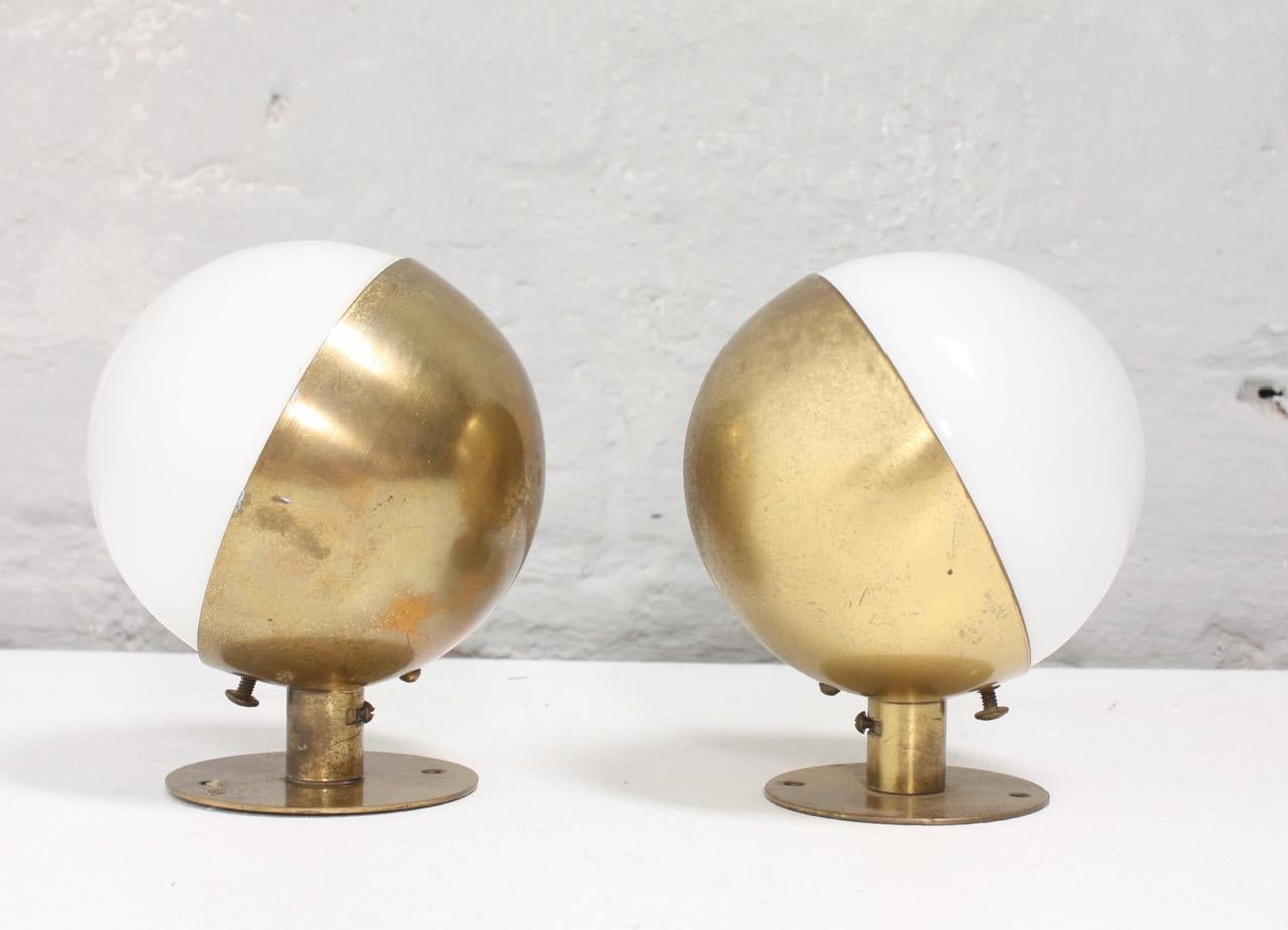 Pair of wall sconces in brass with opal glass shade Model 10630. Designed by Vilhelm Lauritzen and manufactured for Louis Poulsen 1930s. Great original condition.

Literature: “L.P. Nyt”, nr. 35 July 1944, p. 291. Literature: Lisbet Balslev