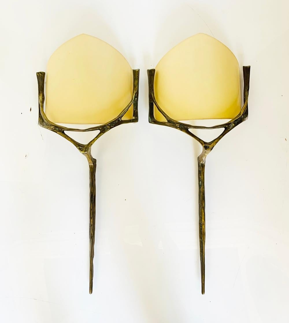 Stunning pair of bronze and brass wall sconces with linen shades.

The pieces are trully stunning, the frames have beautiful architectural lines, very delicate and yet very imposing, perfect for many design styles.

Measurements:
25 inches high