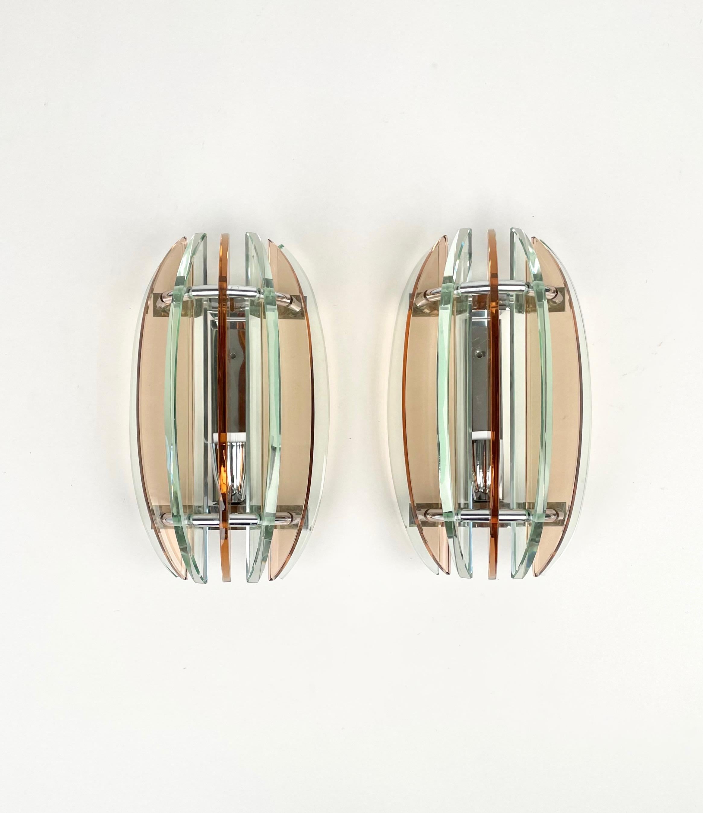 Pair of wall sconces in colored glass (pink and green) and chrome by Veca, Italy, 1970s.