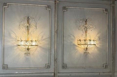 Pair of wall sconces in painted and gilded metal adorned with crystals, Italy
