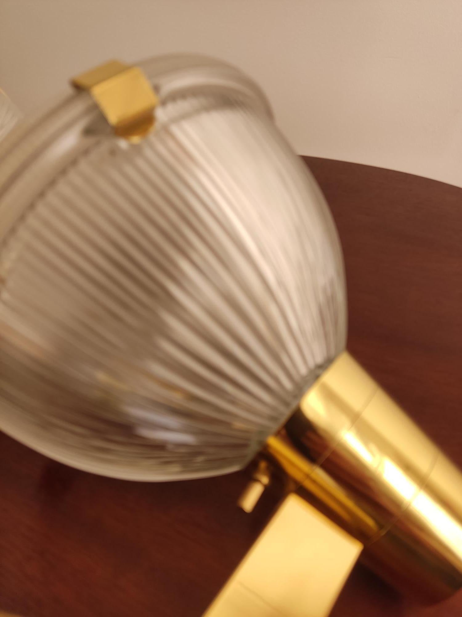 Pair of wall sconces with brass frames and Zeiss glass diffusers.
Manufactured by Stilnovo in the 1950s.
Manufacturer's mark present.
Very good condition