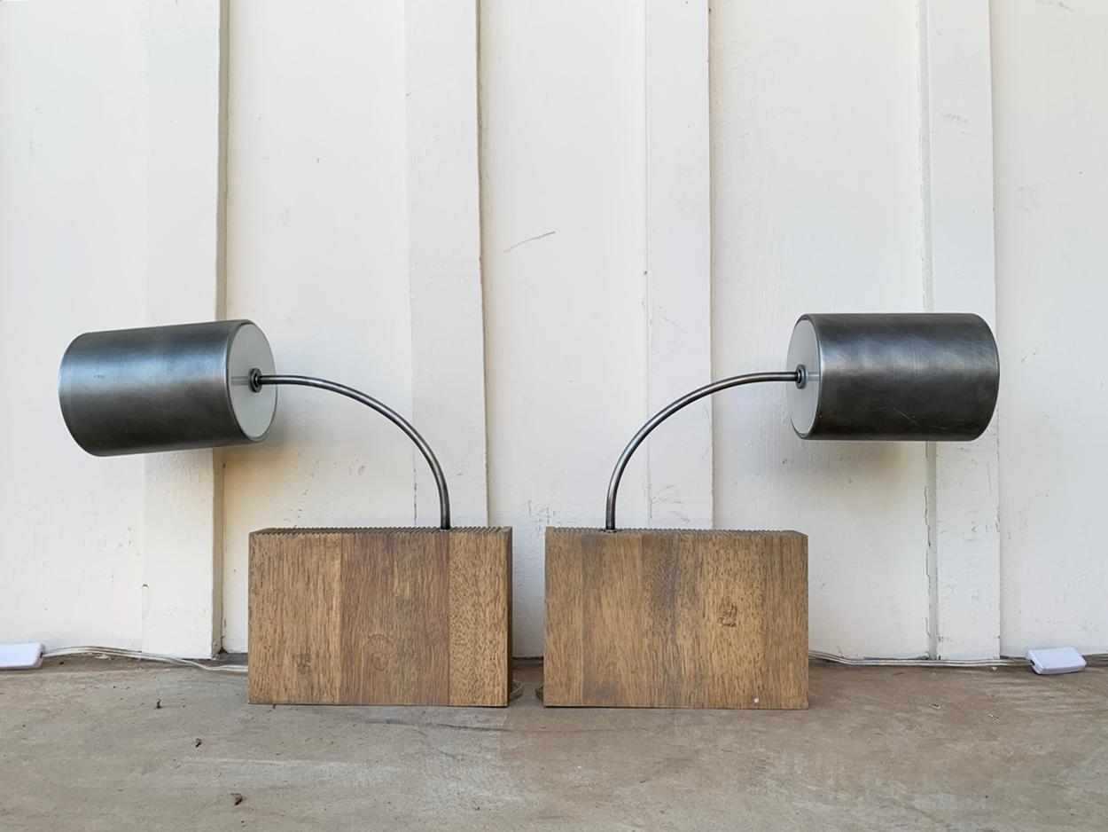 Beautiful and modern wall sconces in metal with thick wood block bases.

The pieces are in working condition and with minimal use, no makers mark. 
Made in 1/2013

Measurements:
15 inches high x 17.25 deep from front to back 
Shades are 5