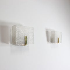 Pair of wall sconces with wooden frames, methacrylate shades, and gilt brass
