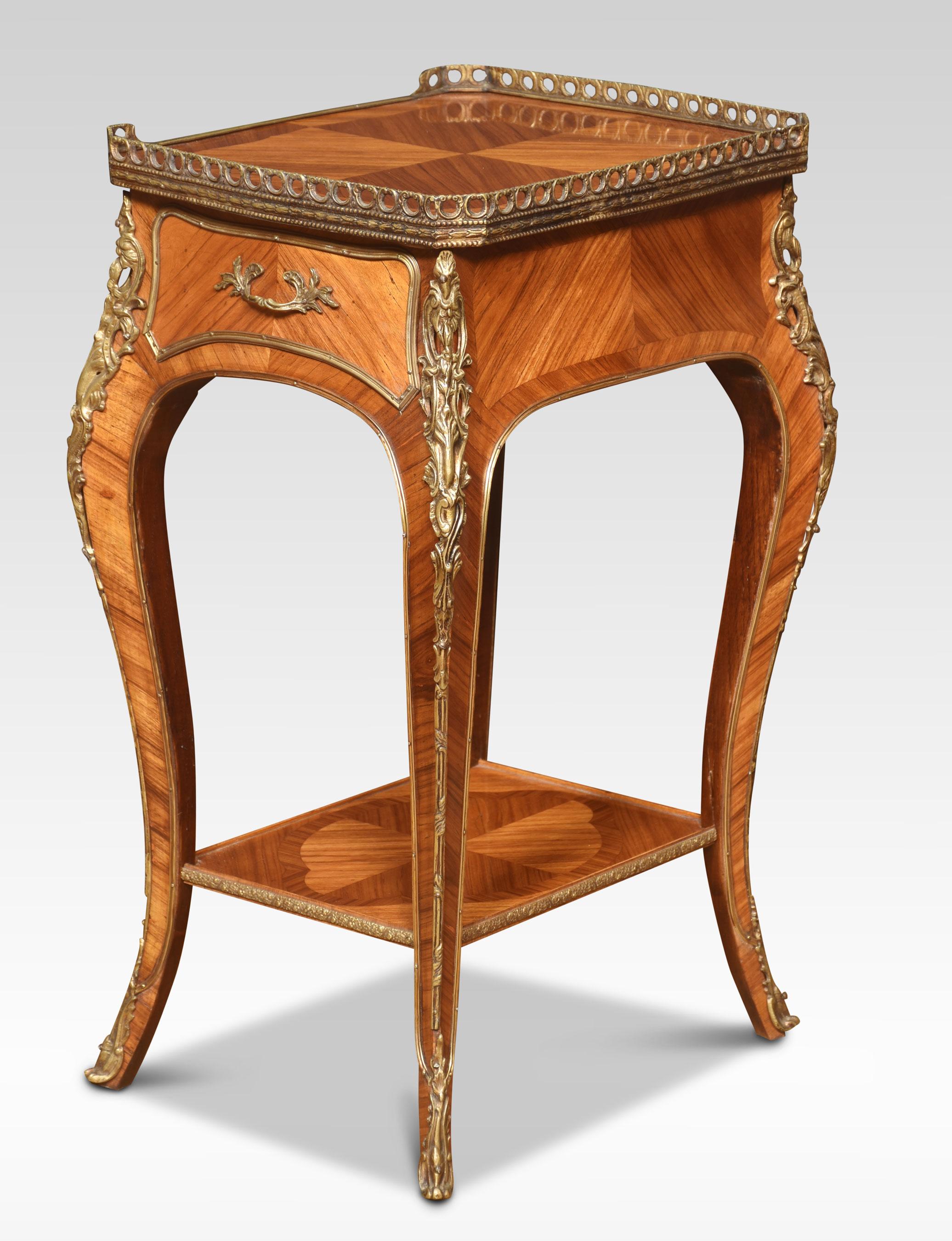 Pair of walnut bedside tables the raised three-quarter pierced gallery above well-figured quarter veneered tops. To the freeze with a single drawer having a well-cast handle, to the side a pull-out slide with inset leather. All raised up on four