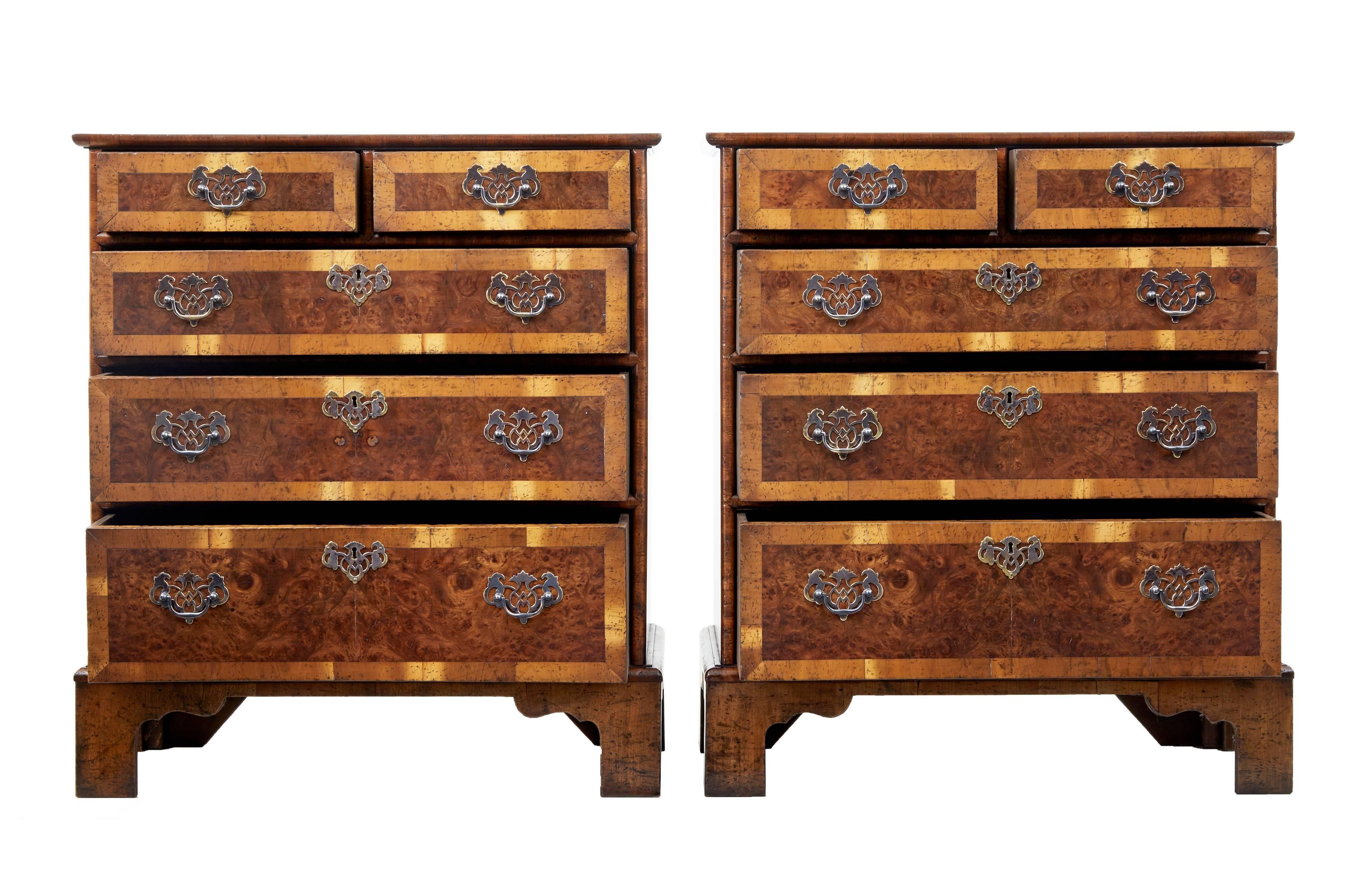 Fine pair of burr walnut chest of drawers.

Two over three graduating drawers each with polished steel decorative handles and escutcheons.

Crossbanded drawer fronts and top.

Standing on bracket feet.