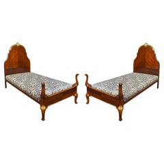Pair of Walnut and Parcel Gilt Beds