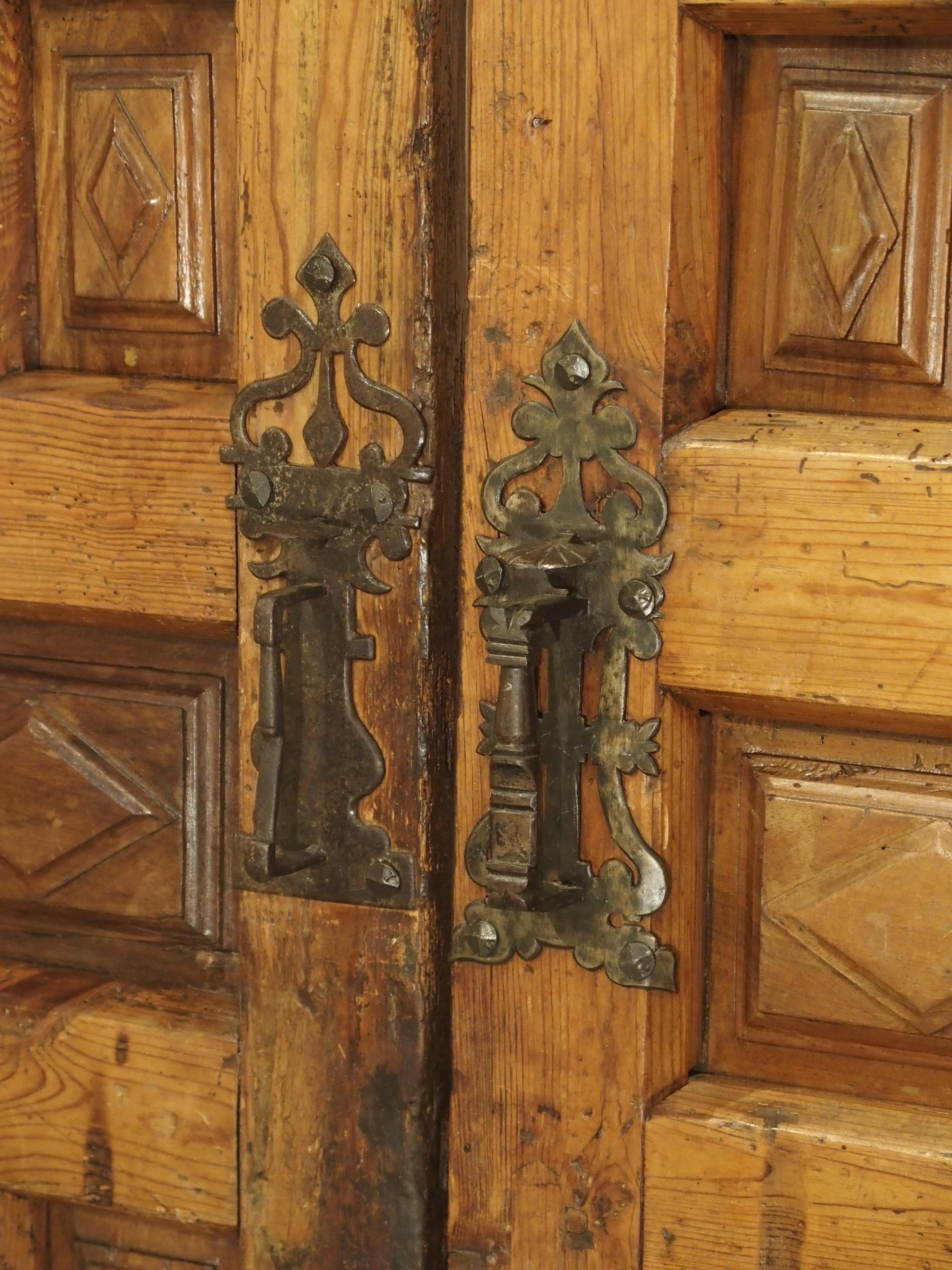 From Spain, these wonderful doors with geometric patterns have been made from walnut wood and pine. As with many architectural elements, starting in the 16th century, and including doors, characteristics included symmetry, order, and proportions.