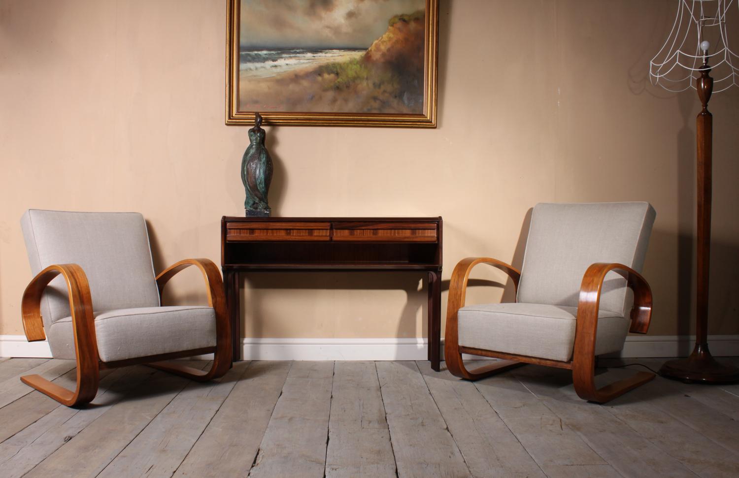Pair of walnut armchairs by Alvar Aalto, circa 1950
A pair of Armchairs produced by Artek and designed by Alvar Aalto in Finland in the early 1950s the walnut arms have been fully polished and seats have been fully upholstered and then covered in