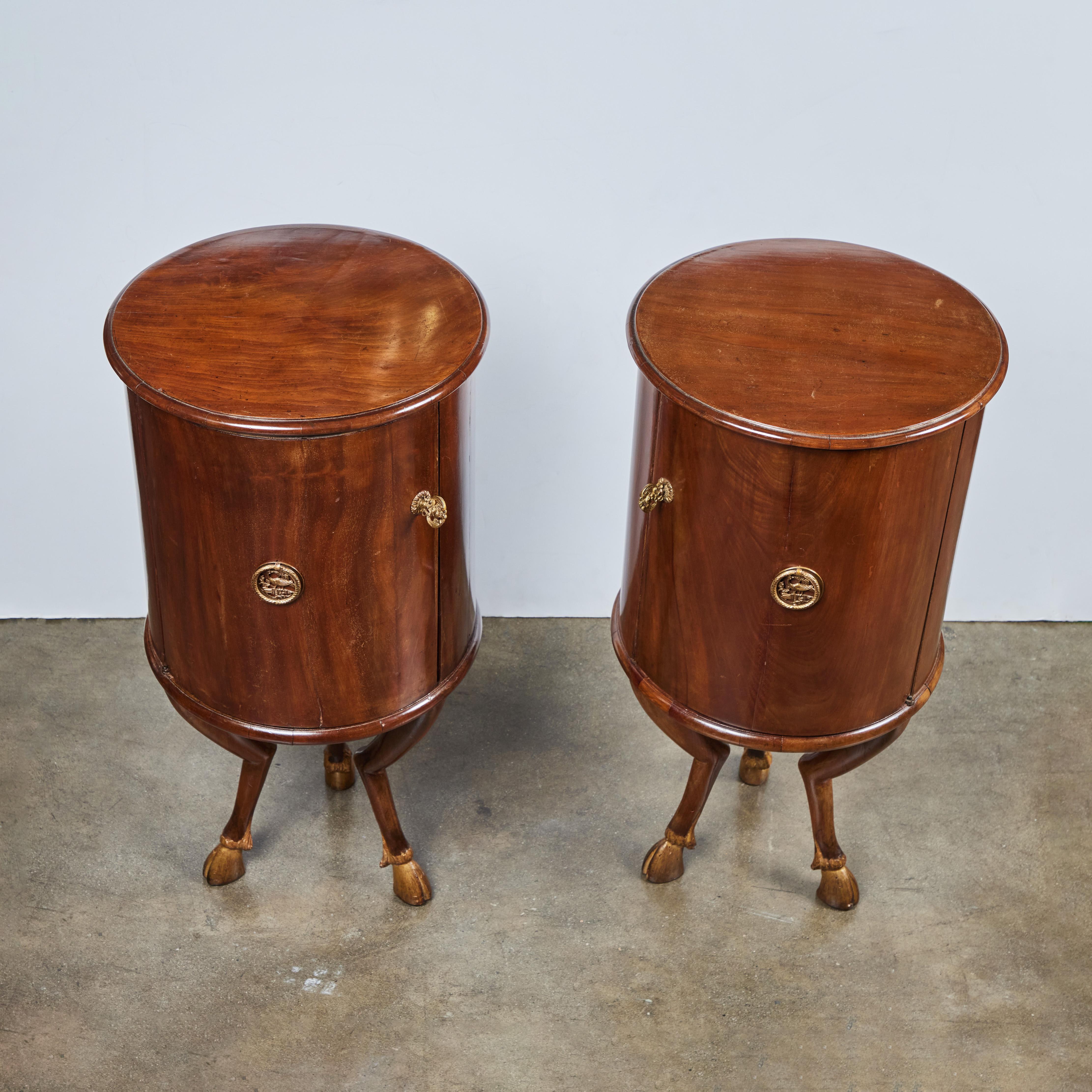 Unique pair of left and right, barrel form, single door, walnut tables, atop a tripod of bent legs terminating in gilt wood, hoof feet. Original, gilt bronze mounts and keys. From Modena, Italy.