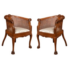 Pair of Walnut bergere arm chairs