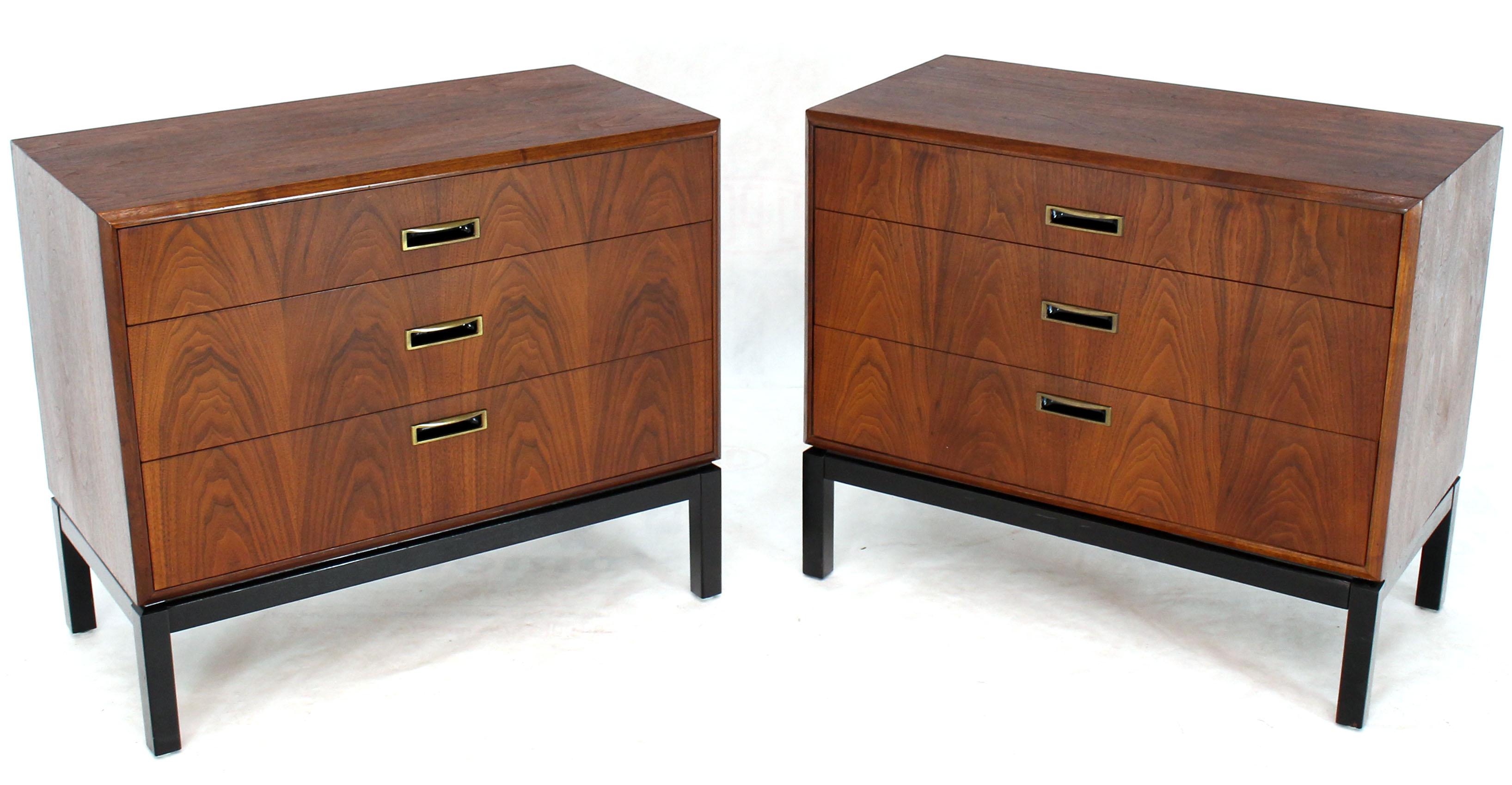 Pair of Mid-Century Modern walnut bachelor chests dresser. Black lacquer bases oiled walnut and brass pulls Milo Baughman looking design. Will work well with Risom and Knoll decor.