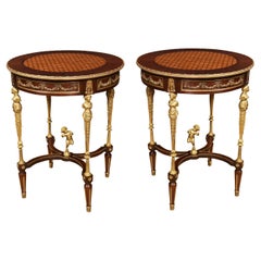 Pair of walnut circular pedestal tables in the manner of Paul Sormani