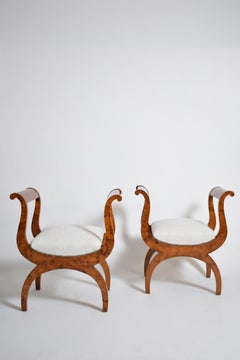 Pair of walnut curule stools, XIXth.