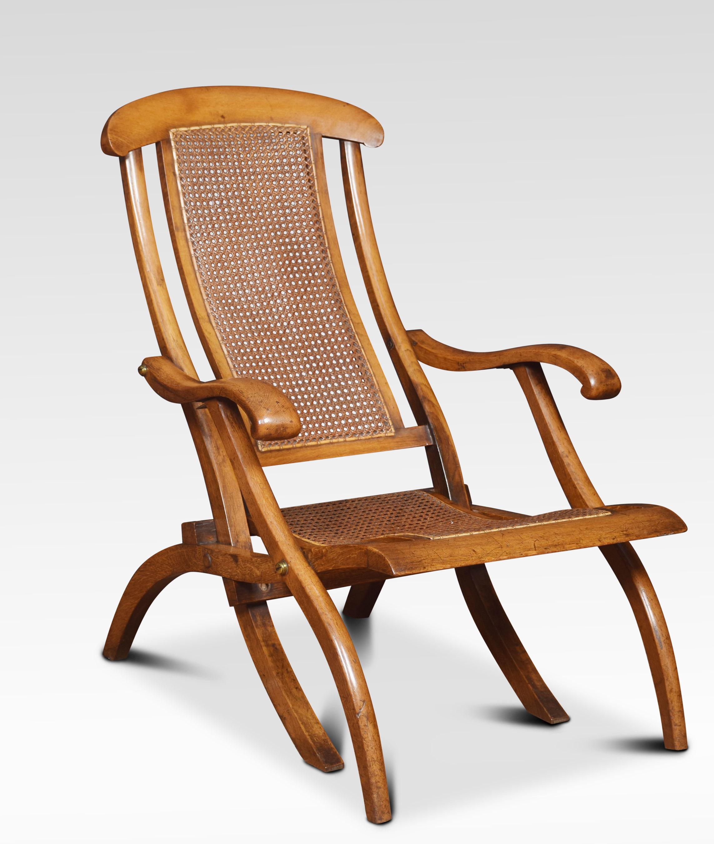 Pair of walnut framed folding steamer deck chairs. The cane work backs and seats, flanked by scrolling arms and splayed legs. They fold very easily for storage.
Dimensions:
Height 34.5 inches, height to seat 13.5 inches
Width 23.5 inches
Depth