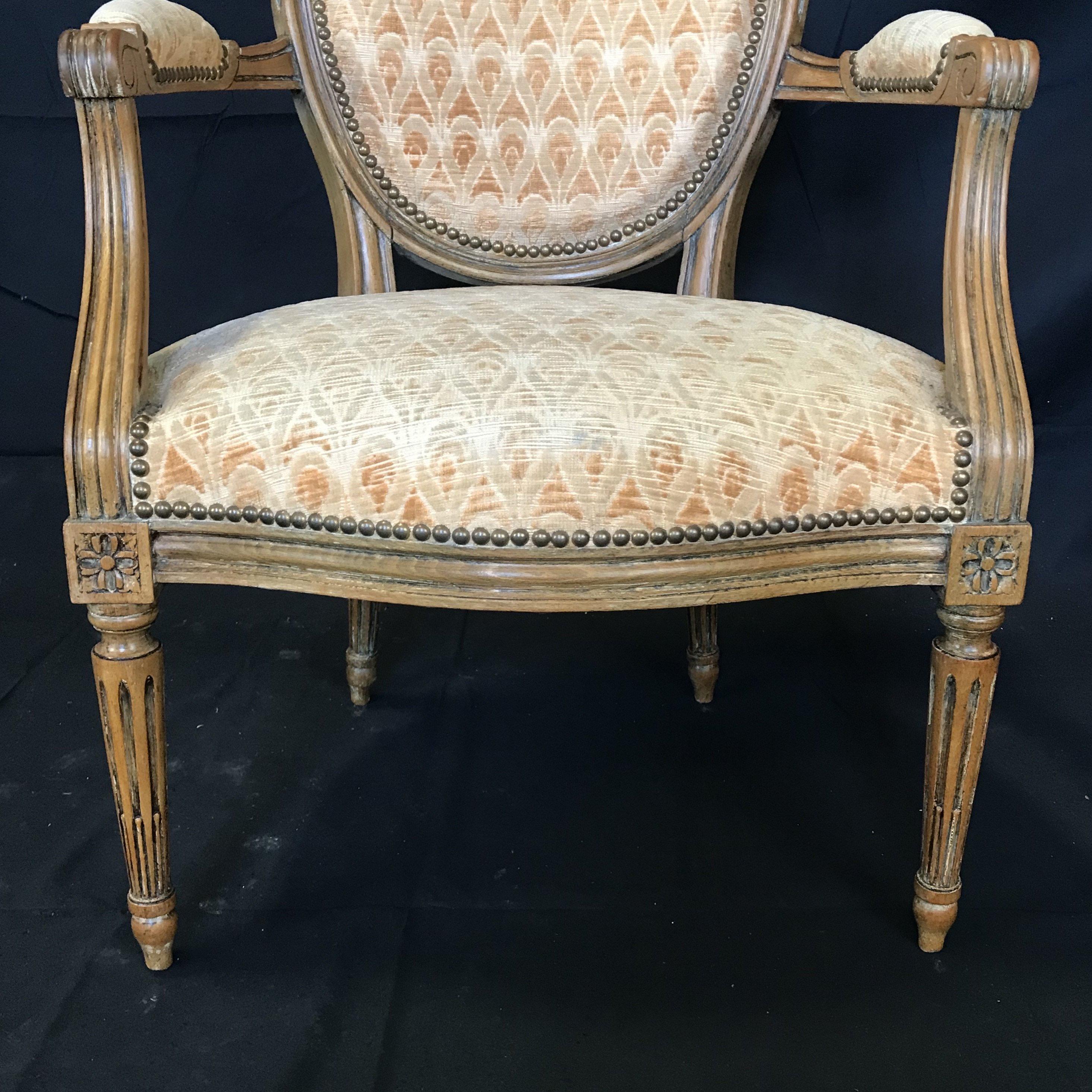 Beautiful pair of Louis XVI armchairs or fauteuils having their original pale gold upholstery in great condition! A great size for accent chairs, armchairs or end accent dining chairs.
#4768.
   