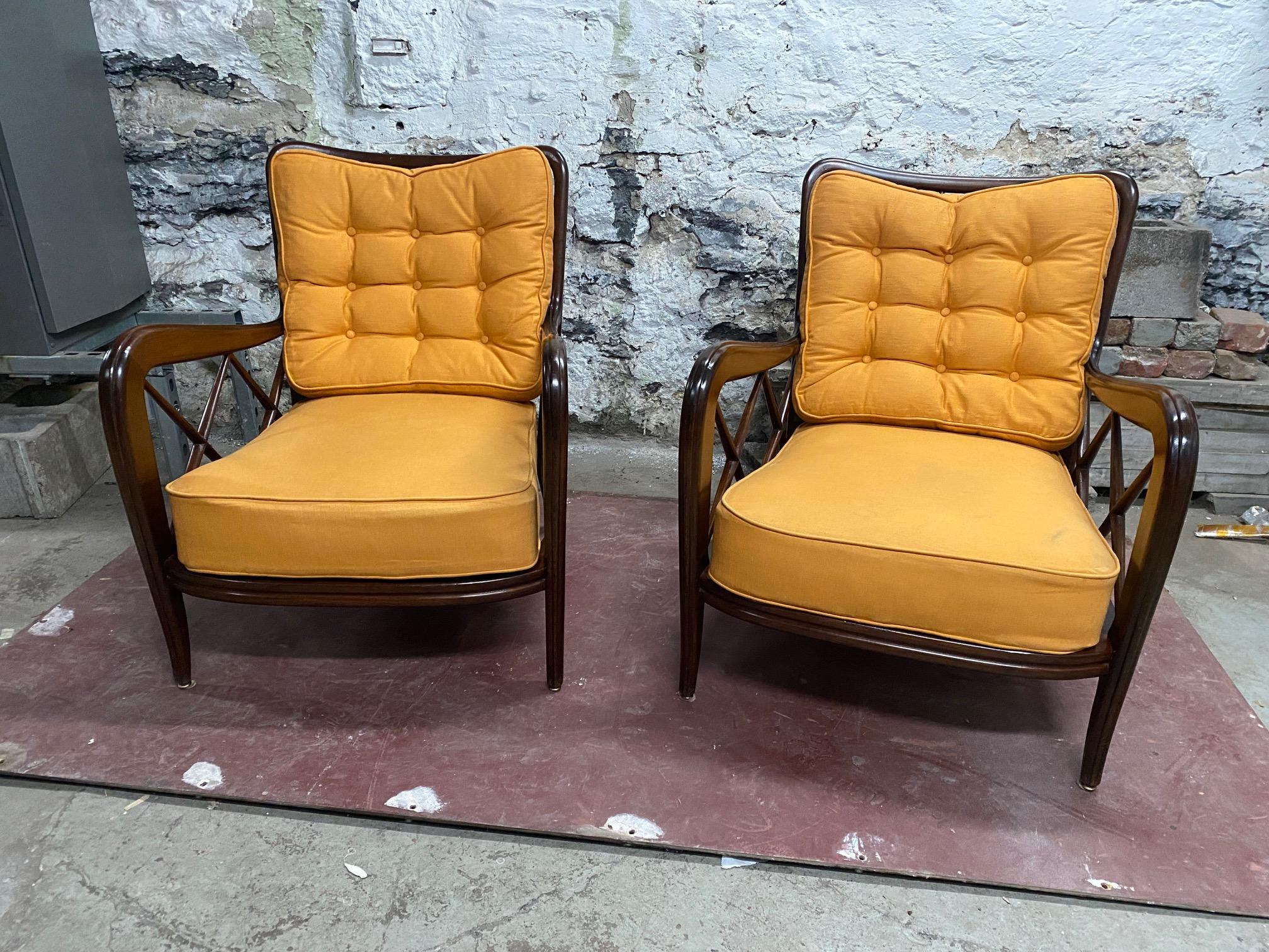 Pair of walnut lounge chairs by Paolo Buffa.